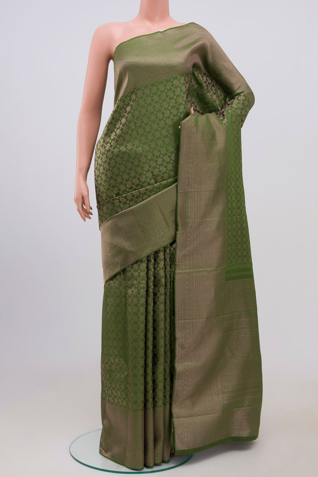 Mehandi Green Kanchipuram Silk Saree with Zari Brocade on the body and Zari Border.  displayed on a mannequin