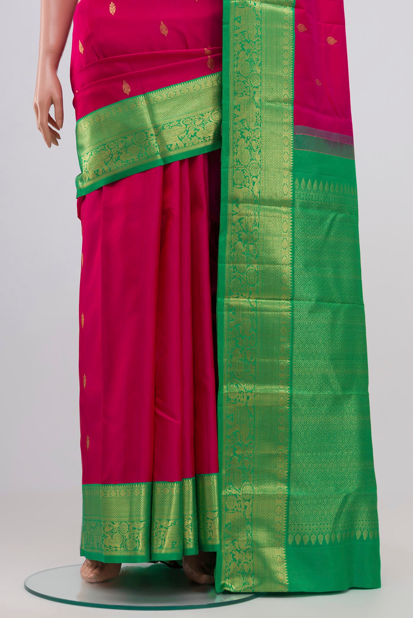Pleats and pallu of Pink Kanjivaram Silk Saree with Zari Butta on the body and Zari Border. 
