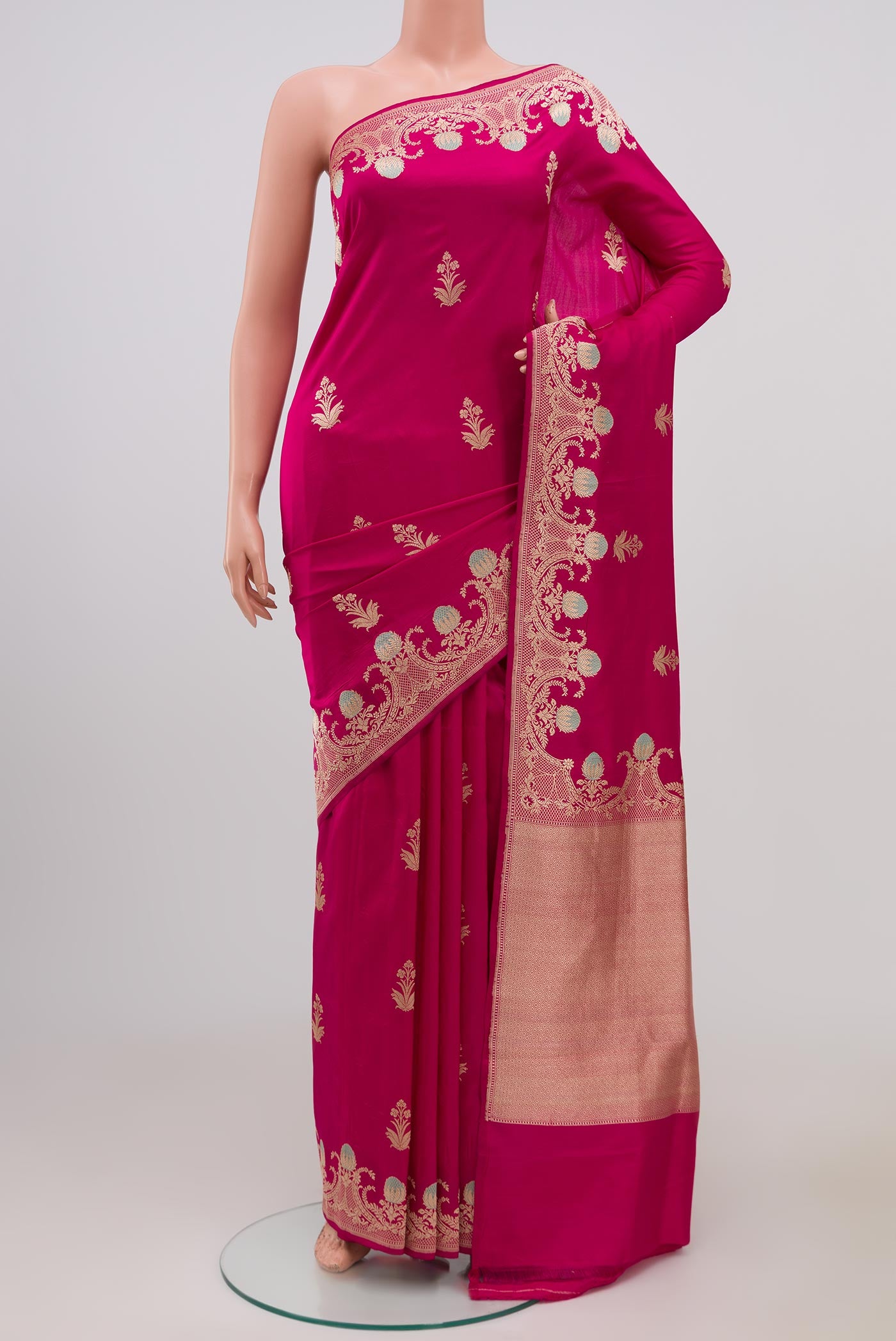 Pink Banarasi Katan Silk Saree with Zari Butta on the body and Fancy Border.  displayed on a mannequin