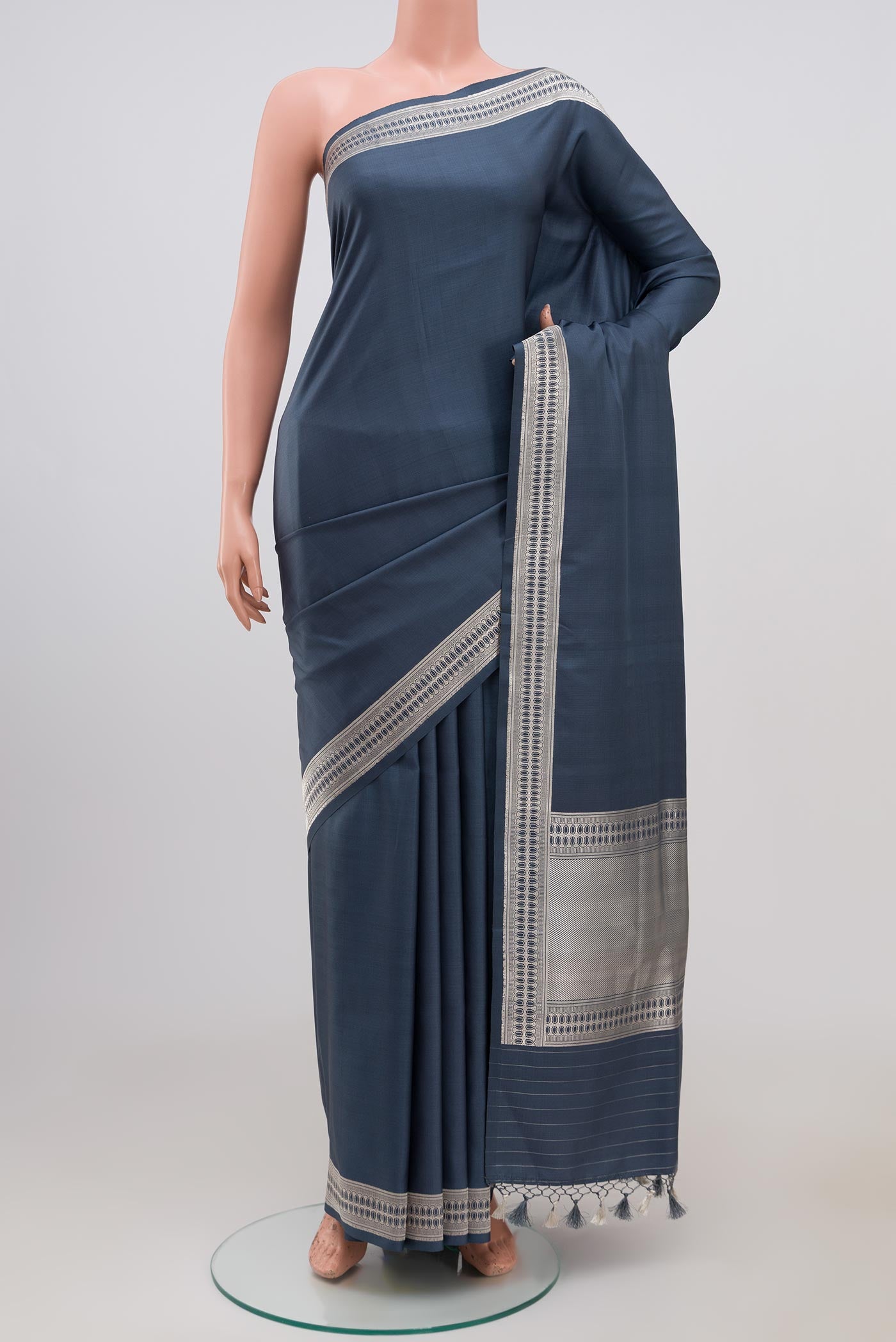 Grey Banarasi Silk Saree with Plain Body and Zari Border.  displayed on a mannequin