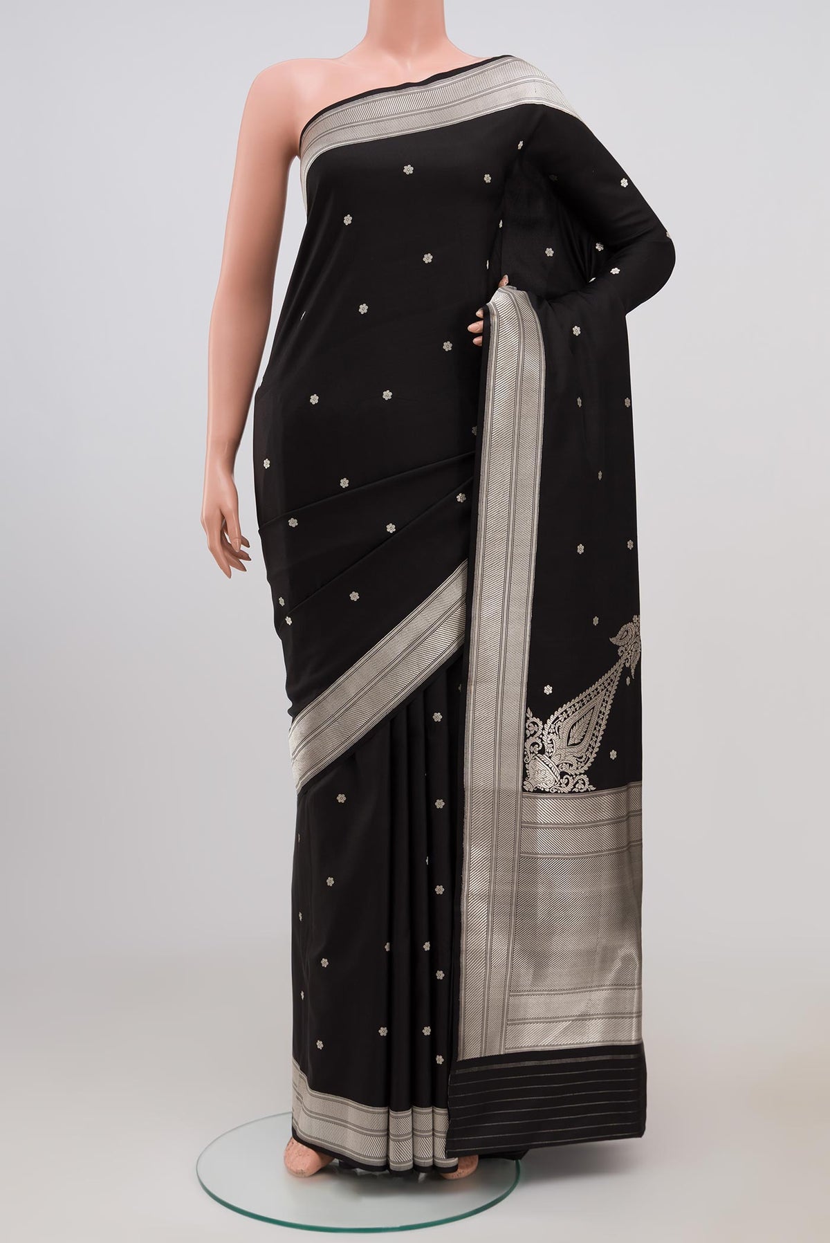 Black Banarasi Silk Saree with Zari Butta on the body and Zari Border.  displayed on a mannequin