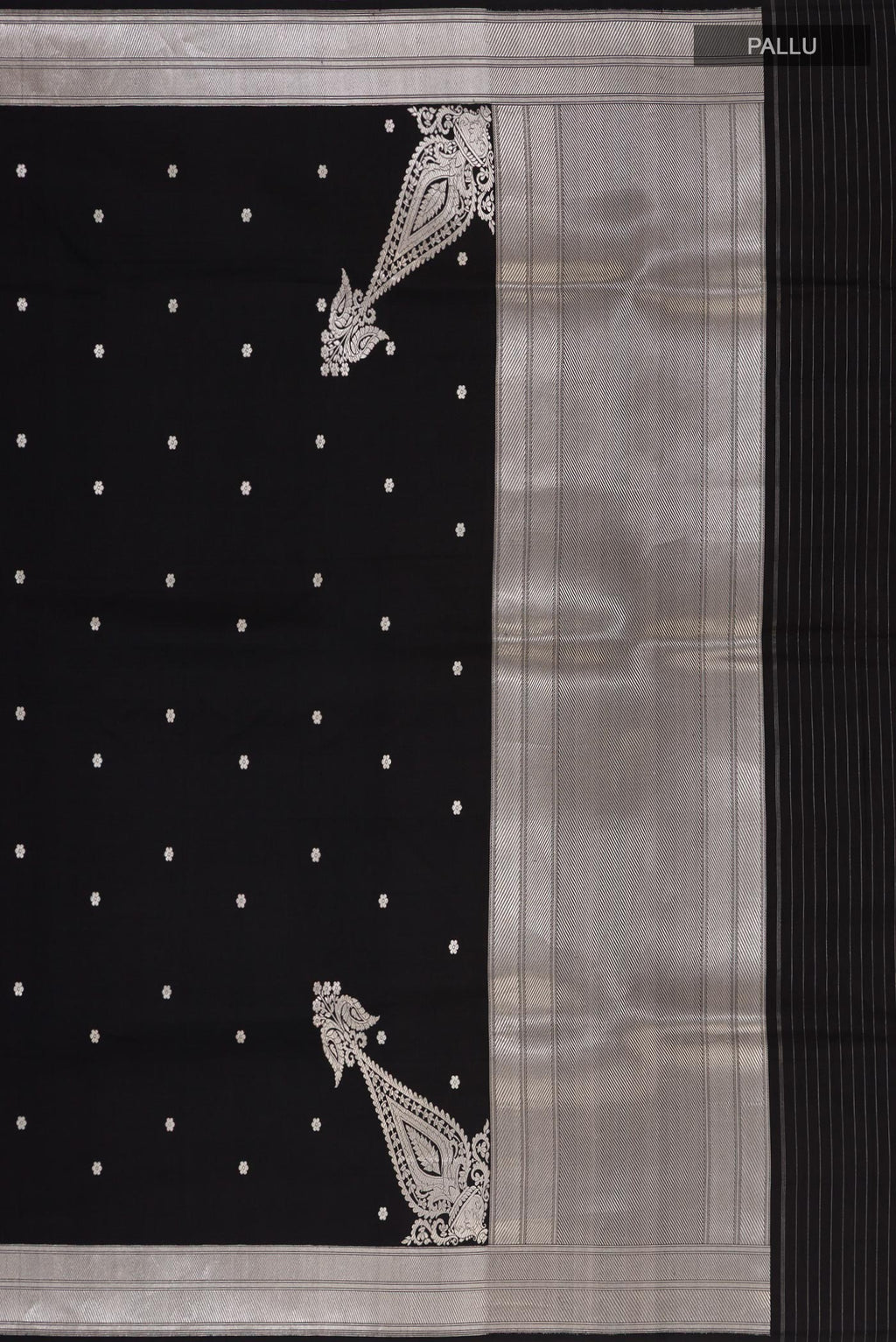 Close up image of the pallu of Black Banarasi Silk Saree with Zari Butta on the body and Zari Border. 
