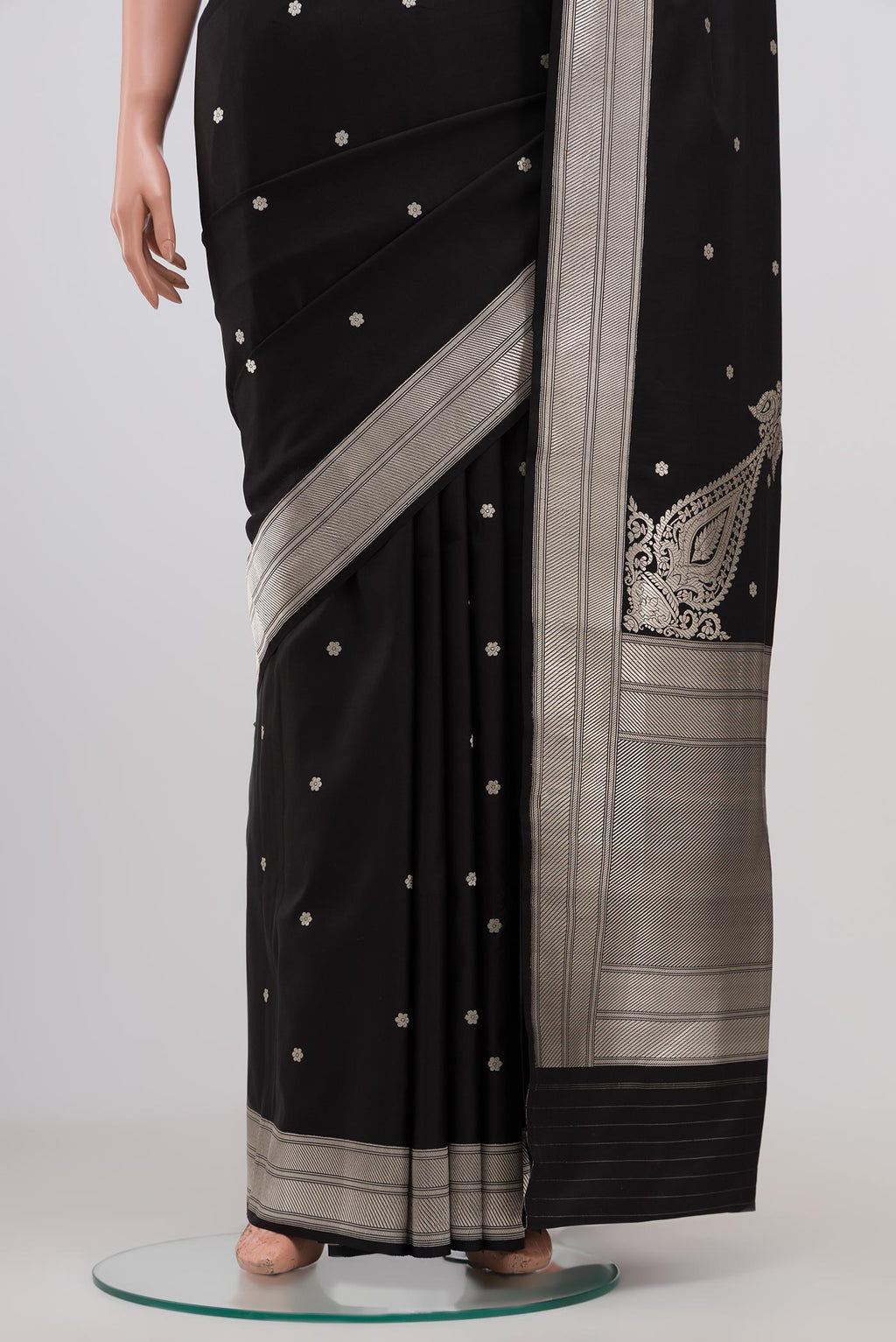 Pleats and pallu of Black Banarasi Silk Saree with Zari Butta on the body and Zari Border. 