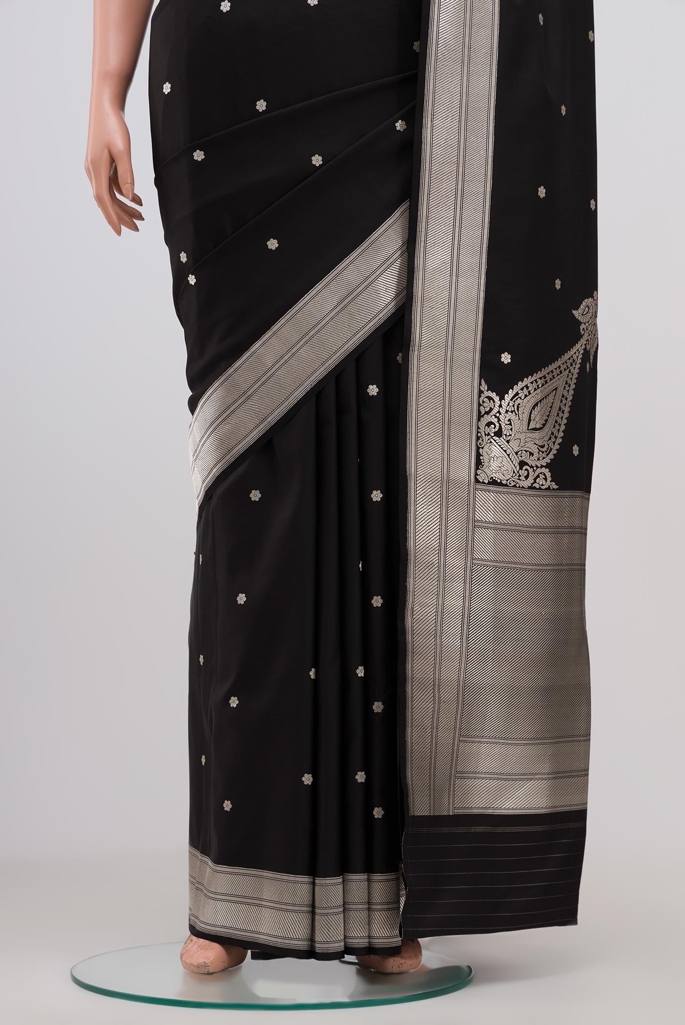 Pleats and pallu of Black Banarasi Silk Saree with Zari Butta on the body and Zari Border. 