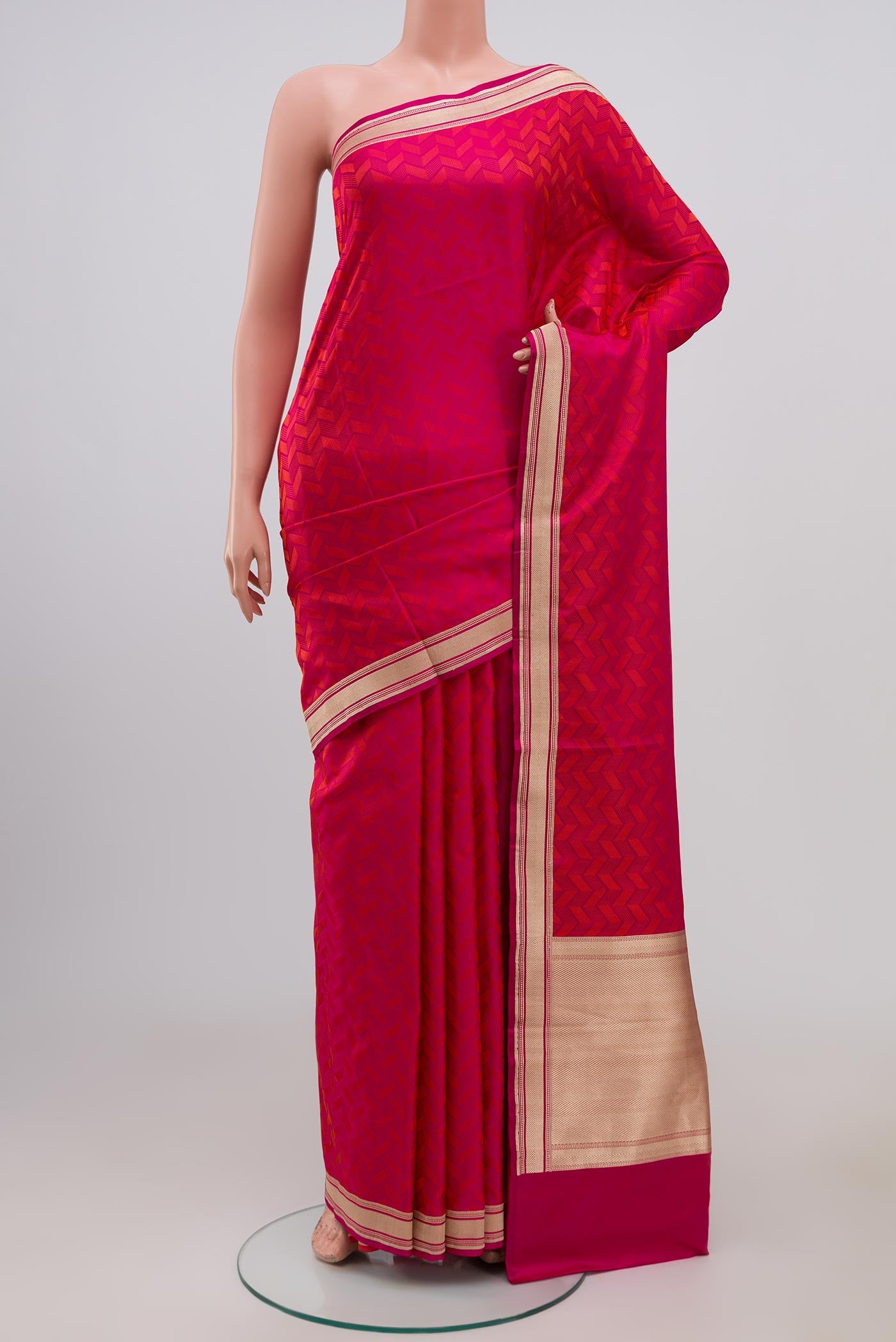 Pink Banarasi Silk Saree with Jacquard design on the body and Zari Border.  displayed on a mannequin