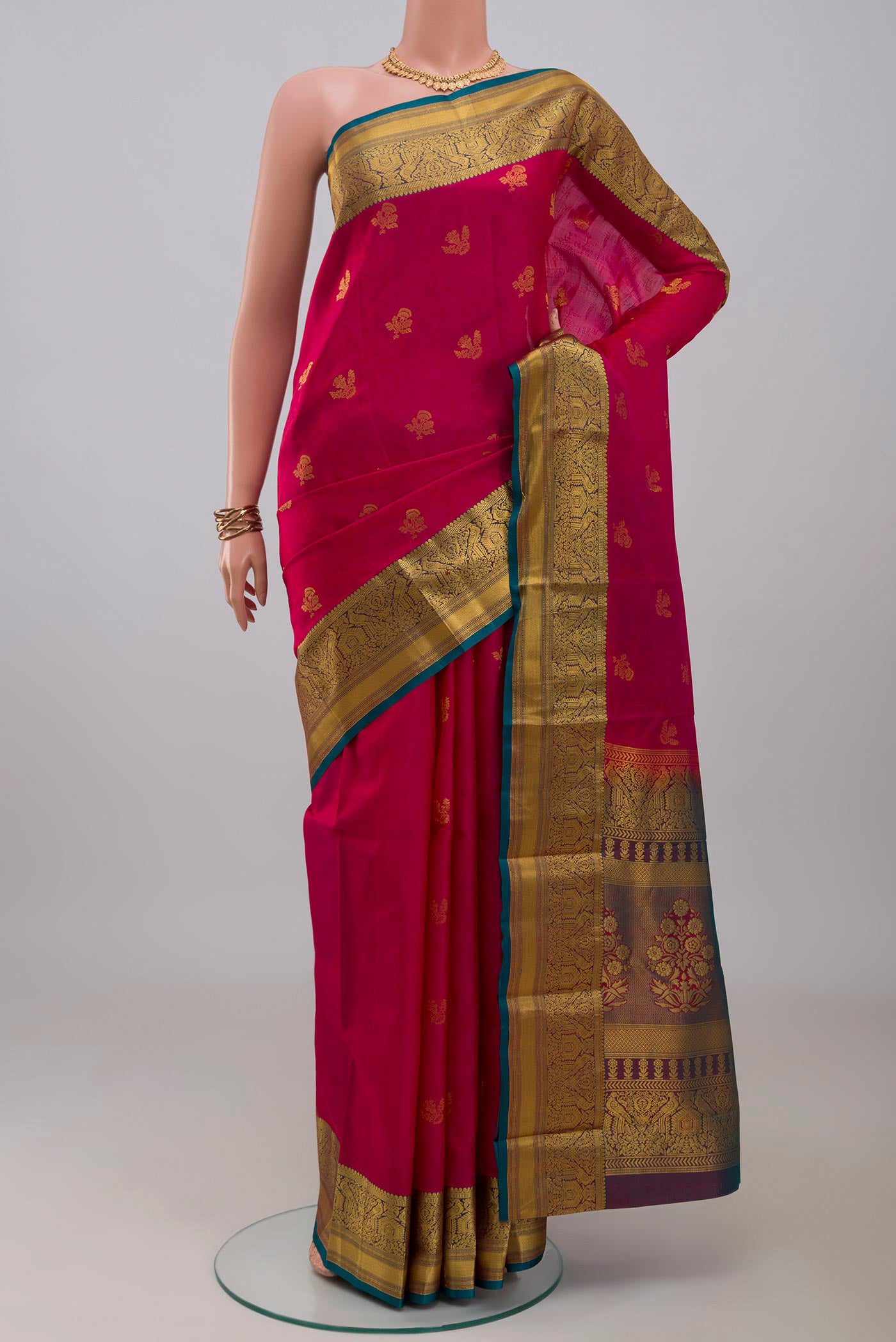 Pink Kanchipuram Silk Saree with Jacquard With Zari Butta on the body and Zari Border.  displayed on a mannequin