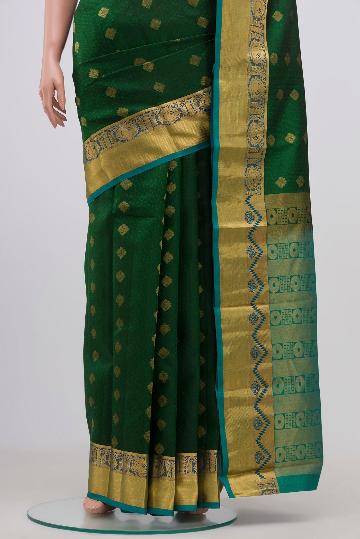 Pleats and pallu of Bottle Green Kanchipuram Silk Saree with Jacquard design on the body and Zari Border. 