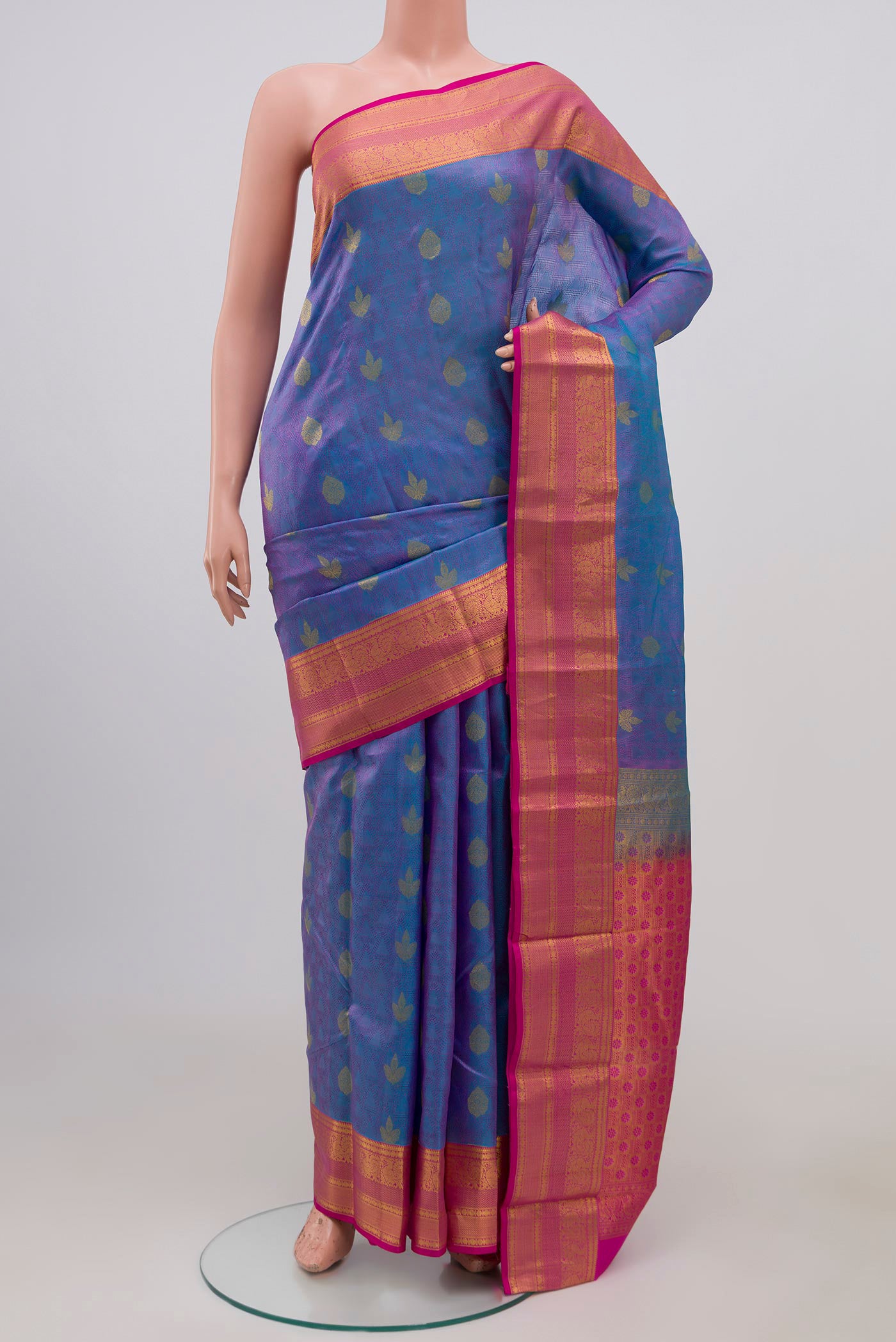 Blue Kanchipuram Silk Saree with Jacquard design on the body and Zari Border.  displayed on a mannequin