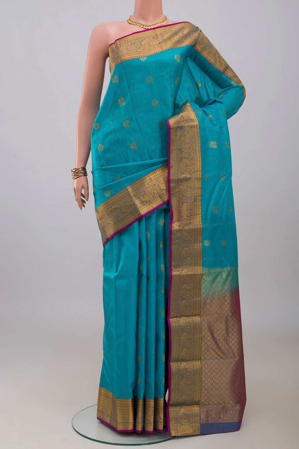Blue Kanchipuram Silk Saree with Jacquard With Zari Butta on the body and Zari Border.  displayed on a mannequin