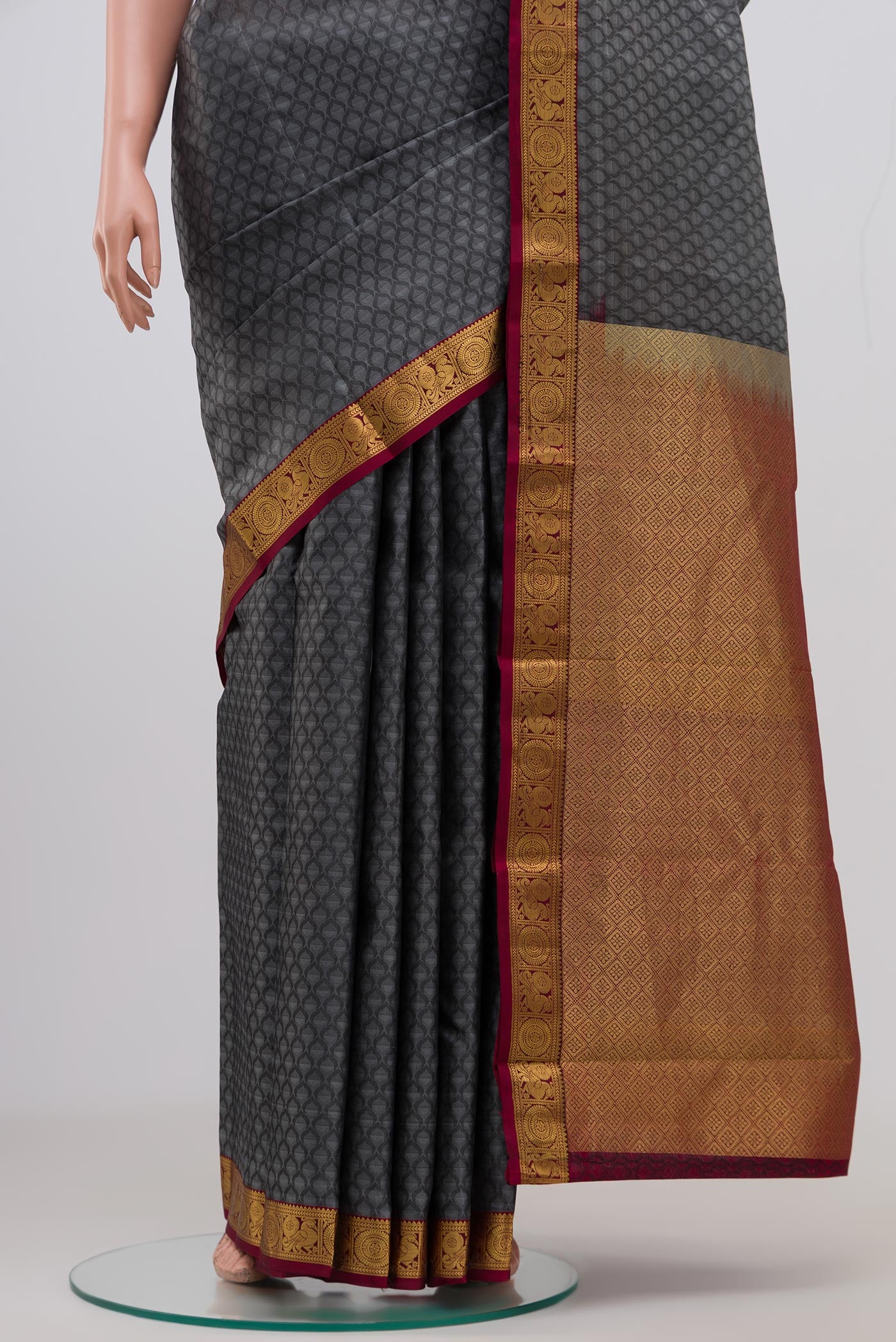 Pleats and pallu of Grey Kanjivaram Saree with Jacquard design on the body and Zari Border. 