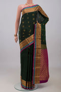 Bottle Green Kanchipuram Silk Saree with Jacquard With Zari Butta on the body and Zari Border.  displayed on a mannequin