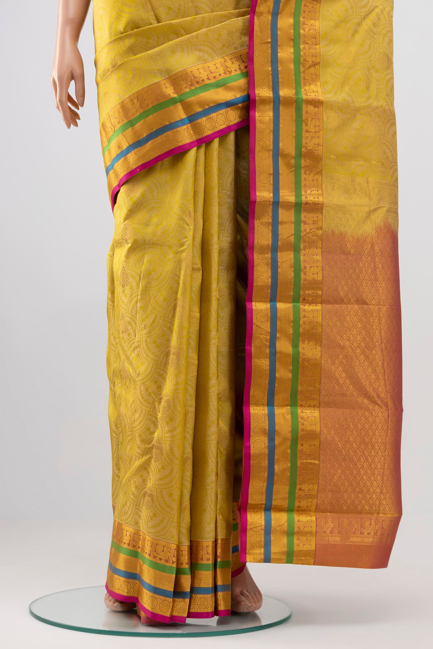 Pleats and pallu of Cream Kanchipuram Silk Saree with Jacquard design on the body and Zari Border. 