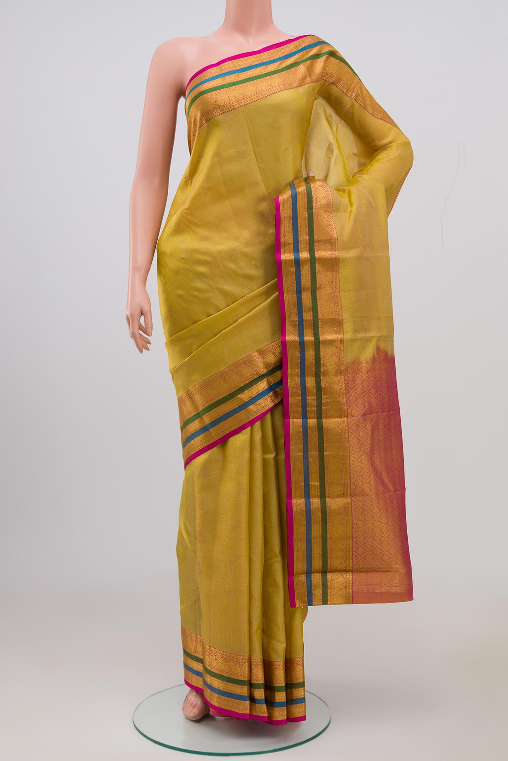 Beige Kanchipuram Saree with Jacquard With Zari Butta on the body and Zari Border.  displayed on a mannequin
