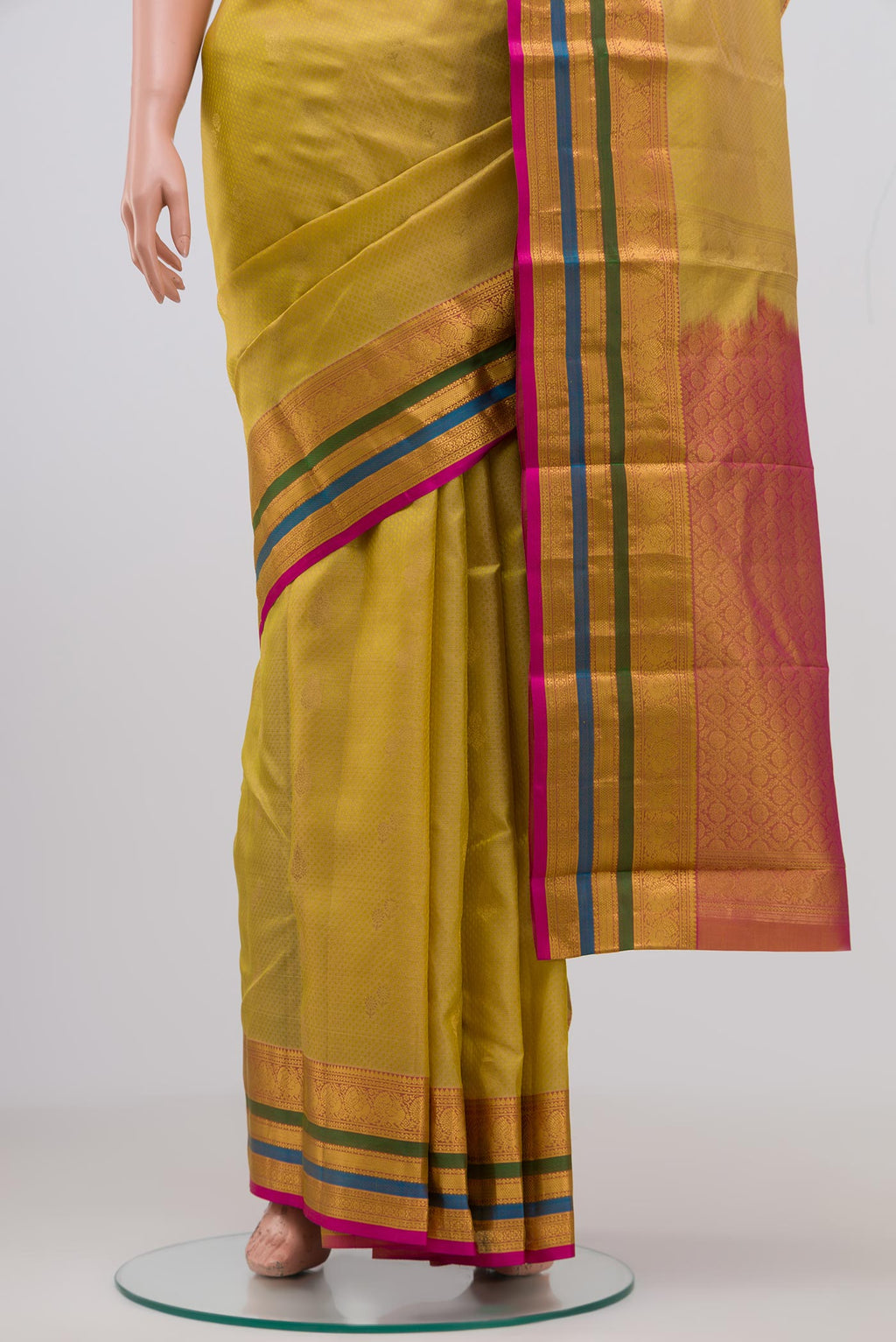 Pleats and pallu of Beige Kanchipuram Saree with Jacquard With Zari Butta on the body and Zari Border. 