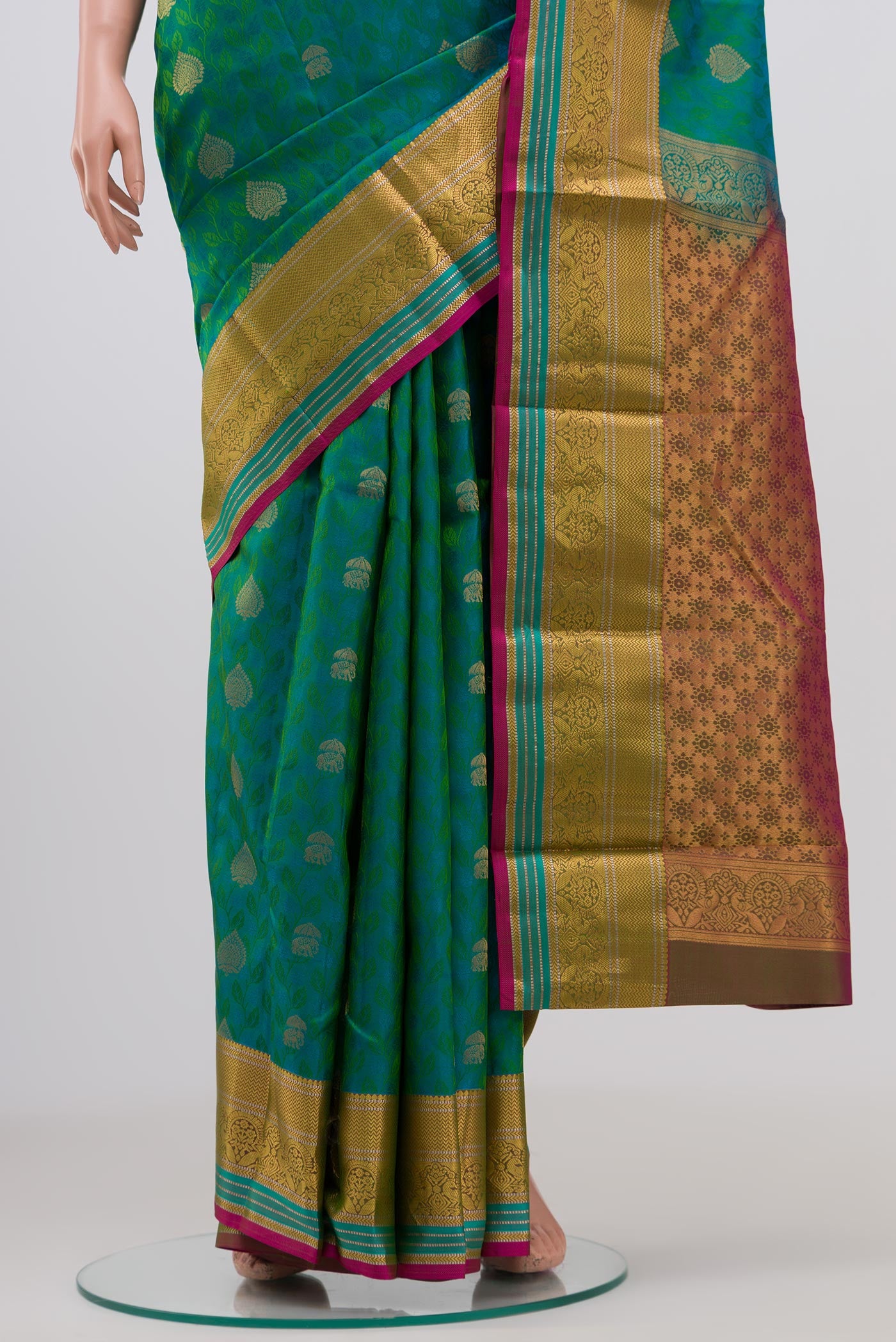 Pleats and pallu of Green Kanchipuram Saree with Jacquard With Zari Butta on the body and Zari Border. 