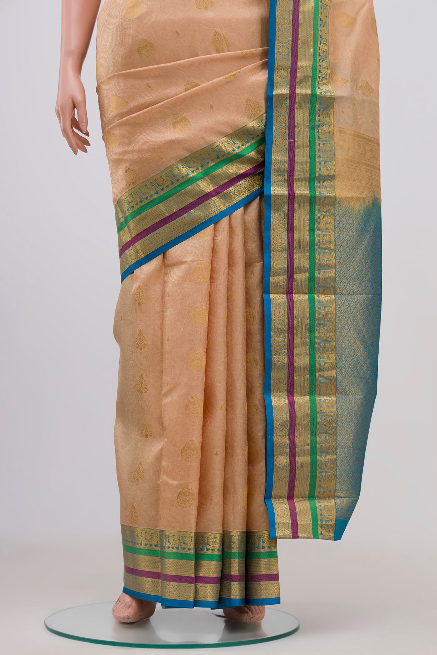 Pleats and pallu of Cream Kanchipuram Silk Saree with Jacquard design on the body and Zari Border. 