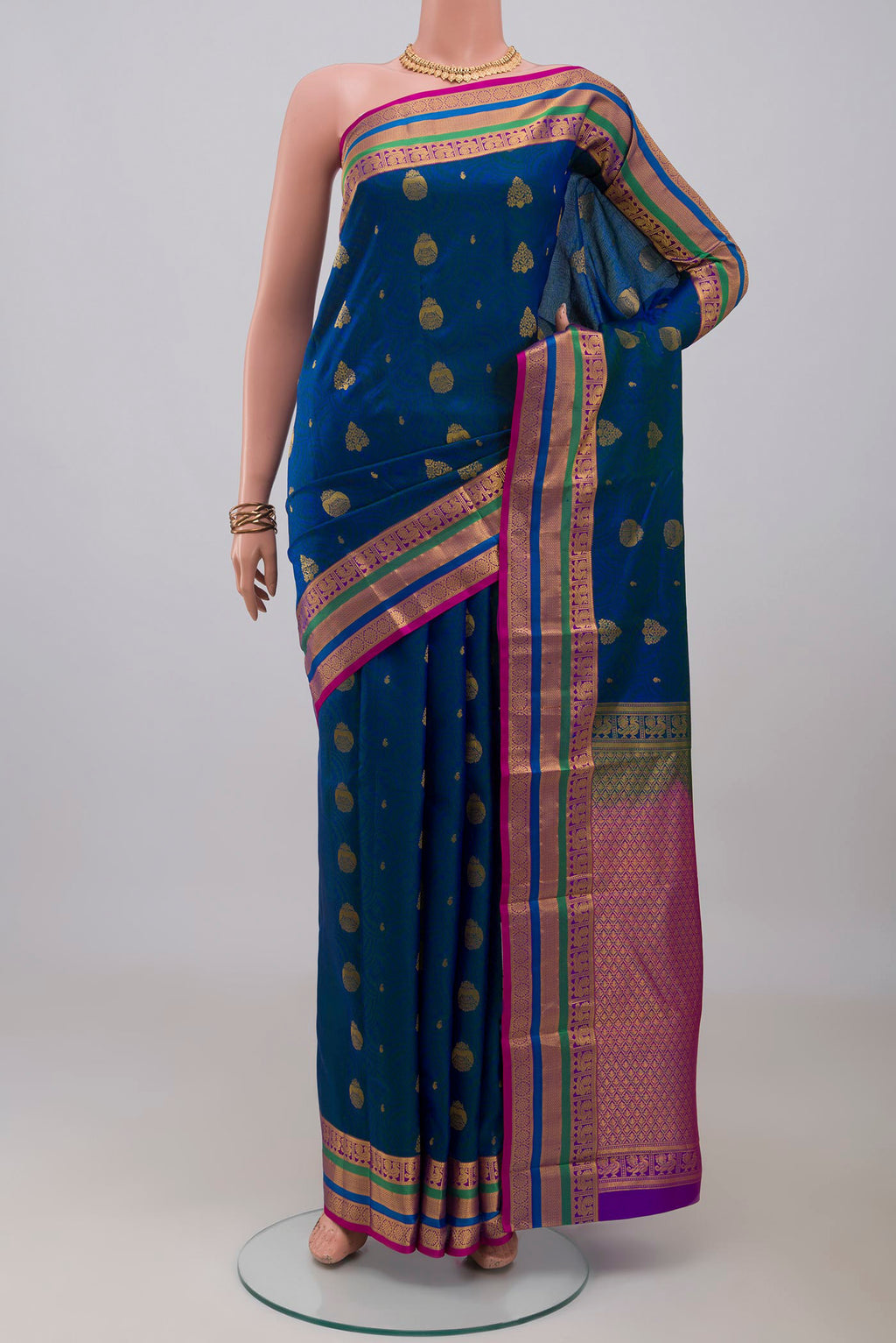 Blue Kanchipuram Silk Saree with Jacquard With Zari Butta on the body and Zari Border.  displayed on a mannequin