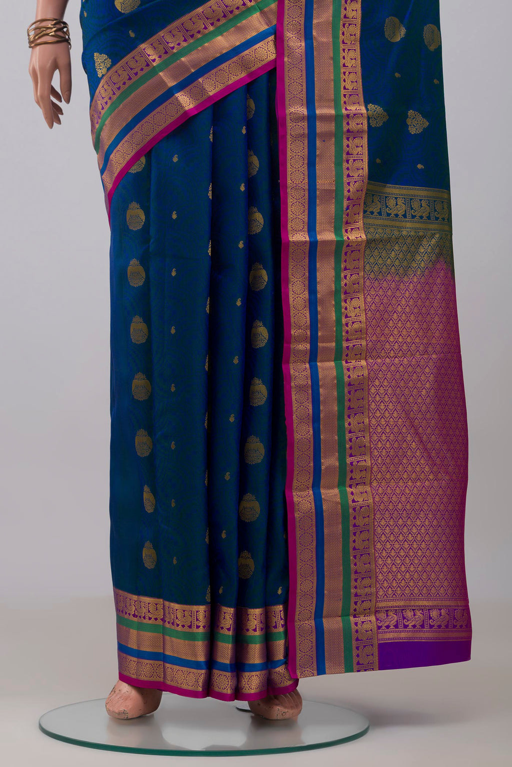 Pleats and pallu of Blue Kanchipuram Silk Saree with Jacquard With Zari Butta on the body and Zari Border. 