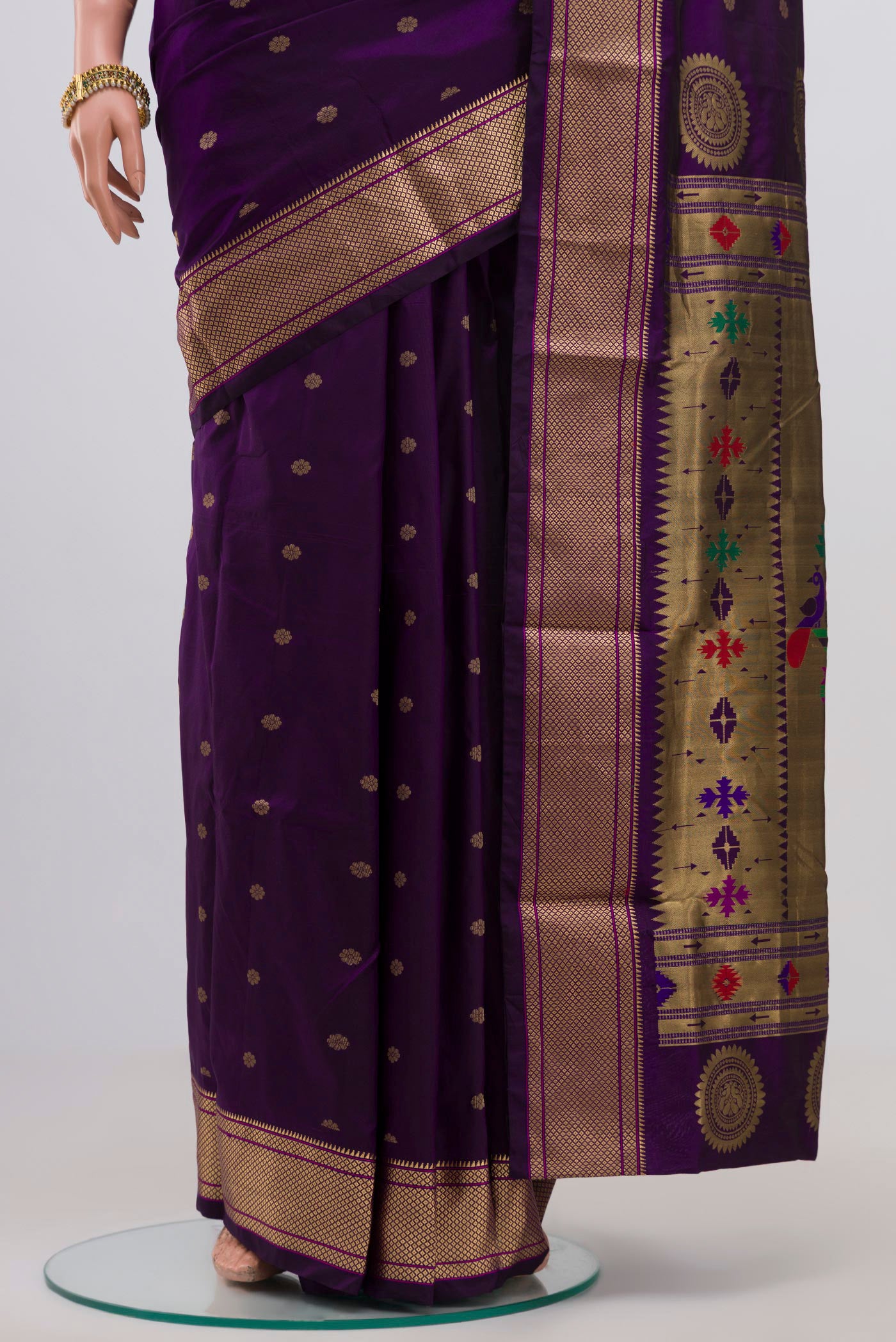Pleats and pallu of Purple Bangalore Silk Saree with Zari Butta on the body and Zari Border. 