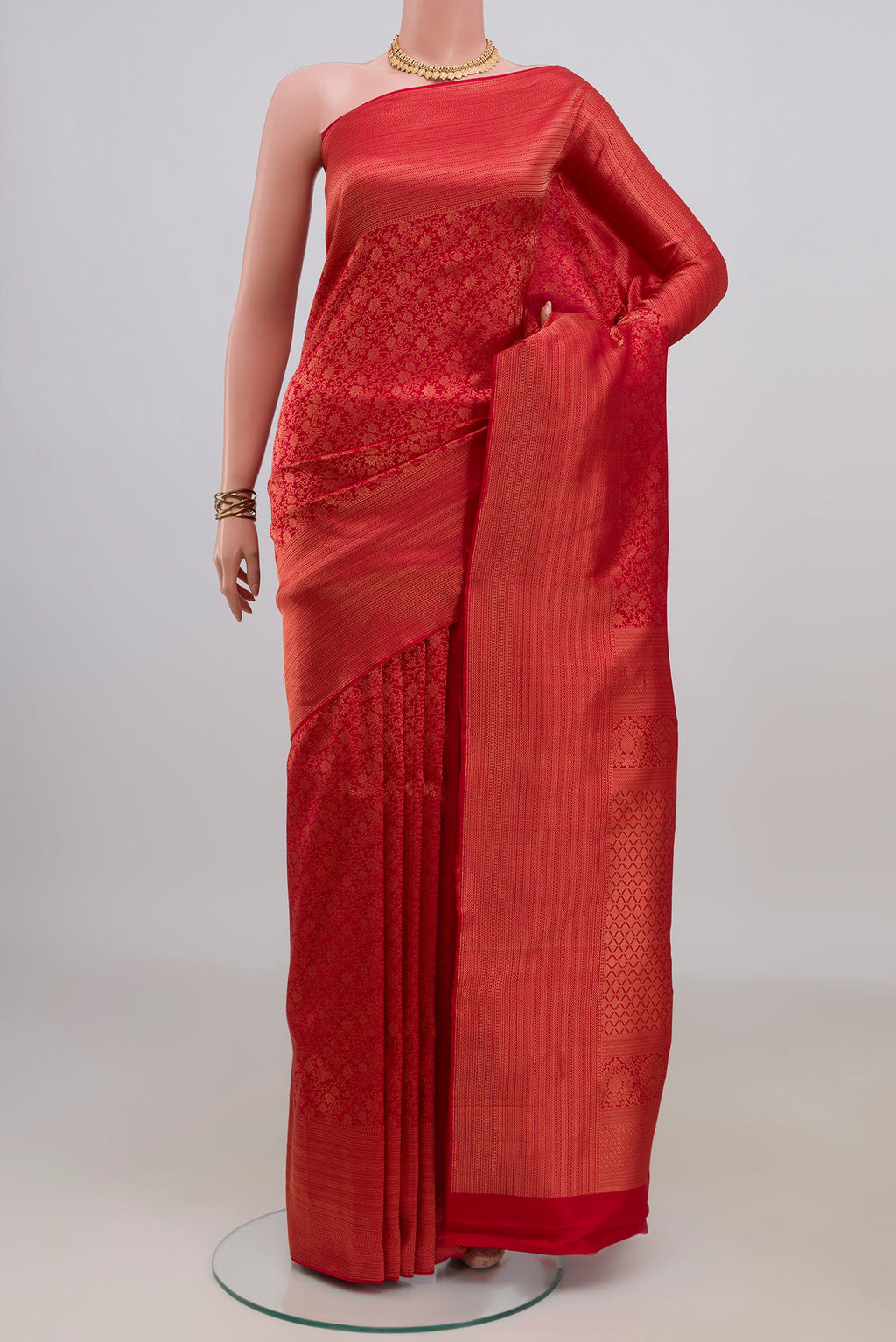 Pure Silk Red Kanchipuram Saree with Zari Brocade on the body and Fancy Border.  displayed on a mannequin
