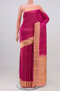 Pure Silk Pure Zari Magenta Kanchipuram Saree with Stripes on the body and Zari Border.  displayed on a mannequin