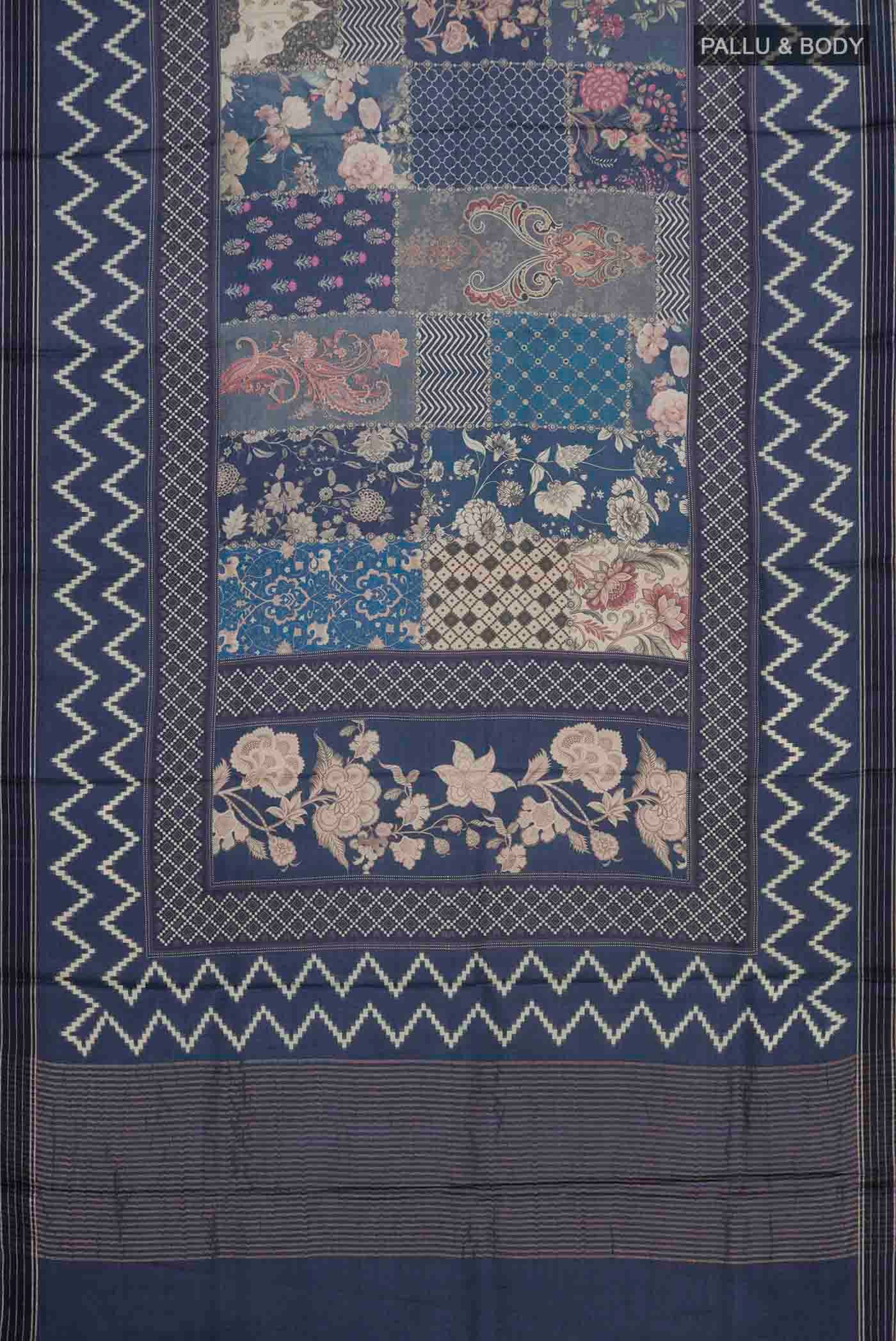 Flat view of Blue Grey Tussar Silk Saree with Printed design on the body and Zari Border. 