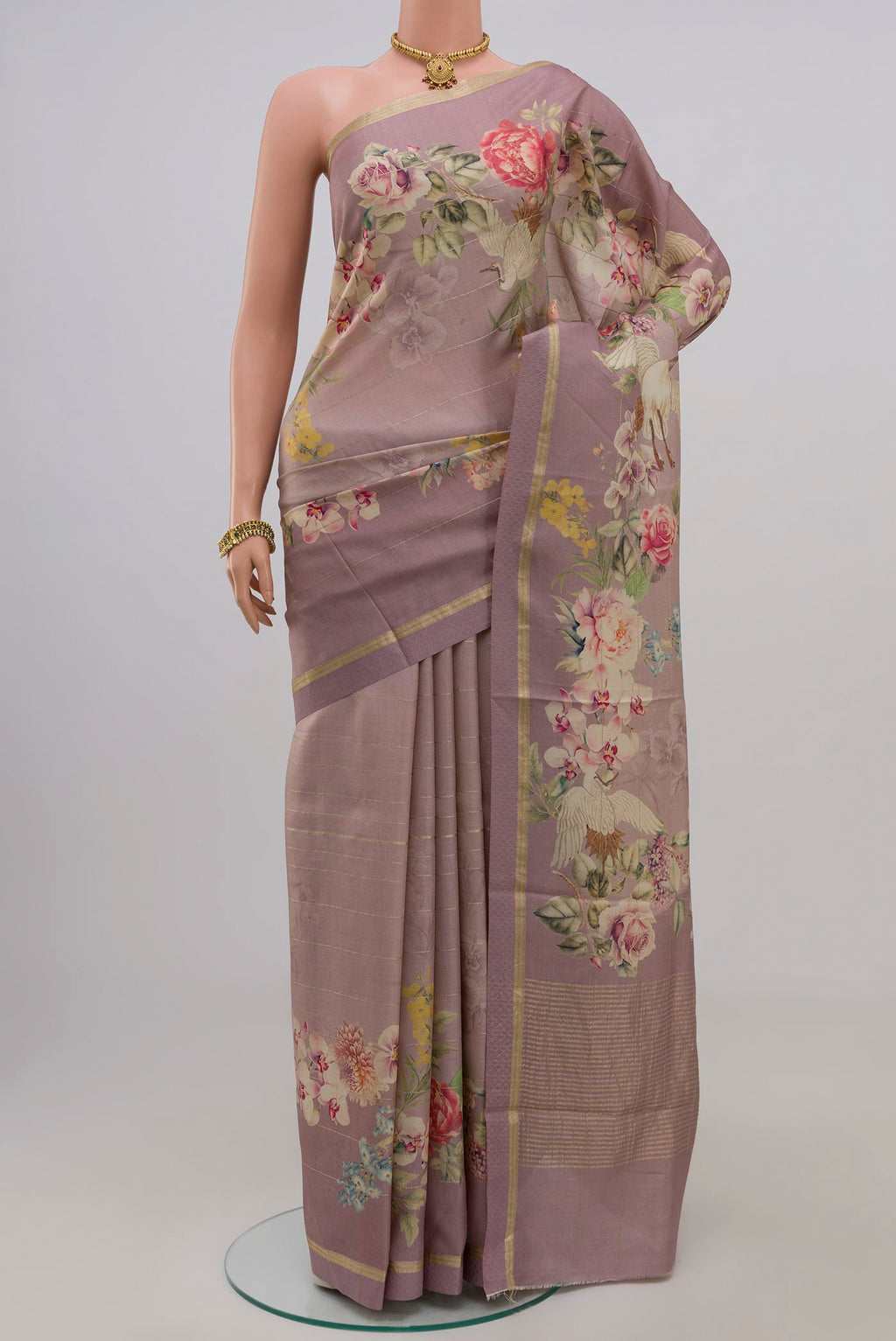 Lavender Tussar Silk Saree with Fancy on the body and Thin Zari Line.  displayed on a mannequin