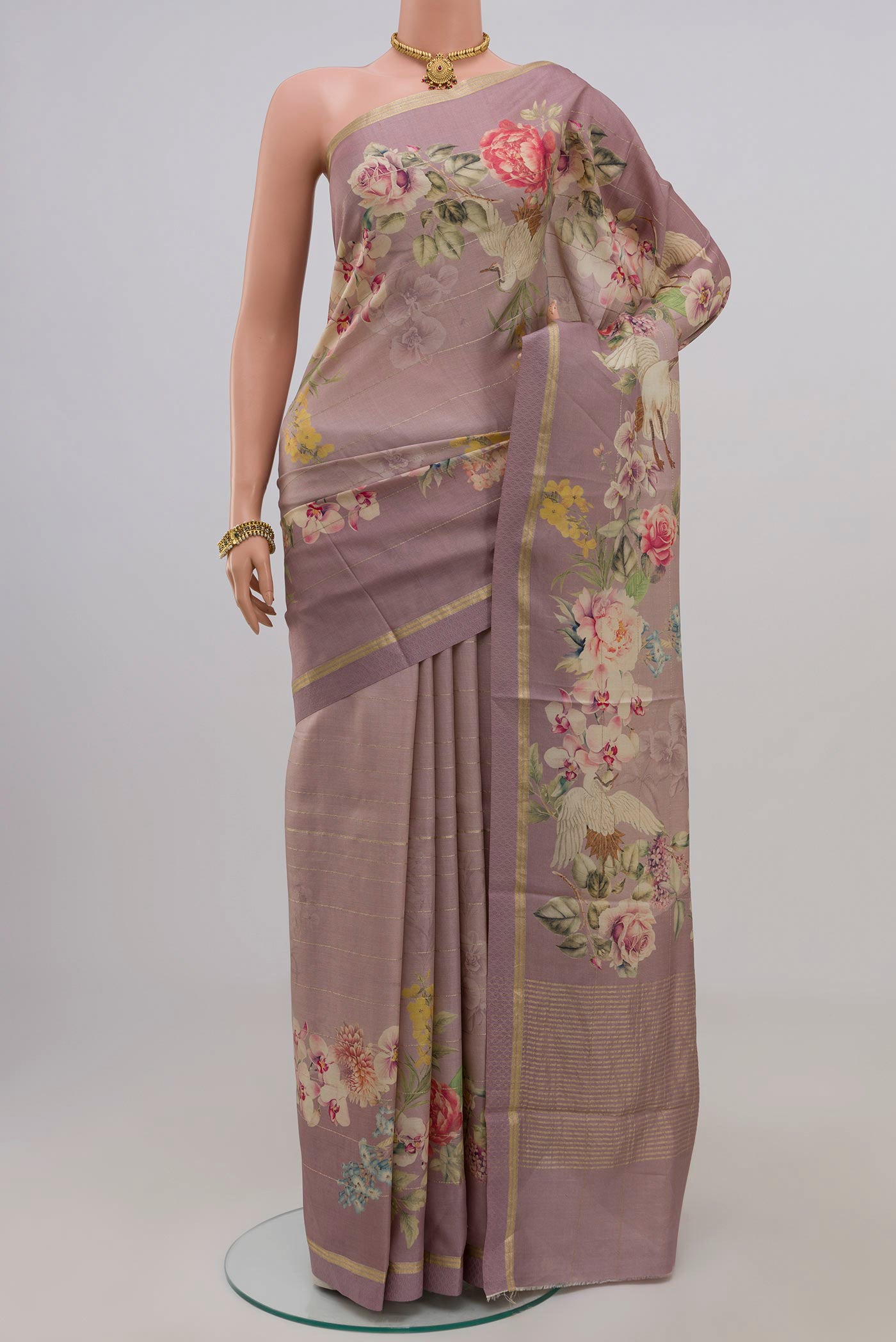 Lavender Tussar Silk Saree with Fancy on the body and Thin Zari Line.  displayed on a mannequin