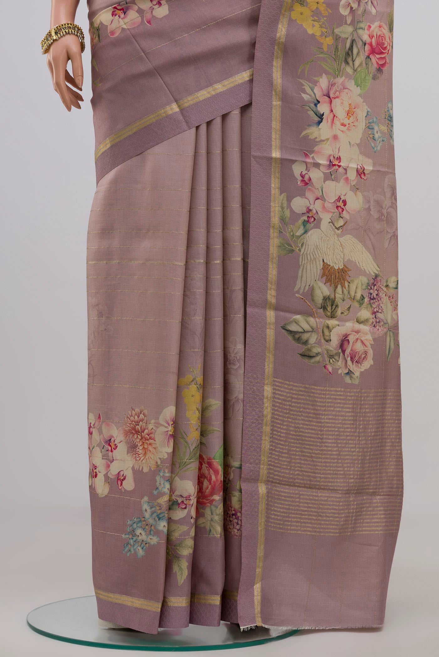 Pleats and pallu of Lavender Tussar Silk Saree with Fancy on the body and Thin Zari Line. 