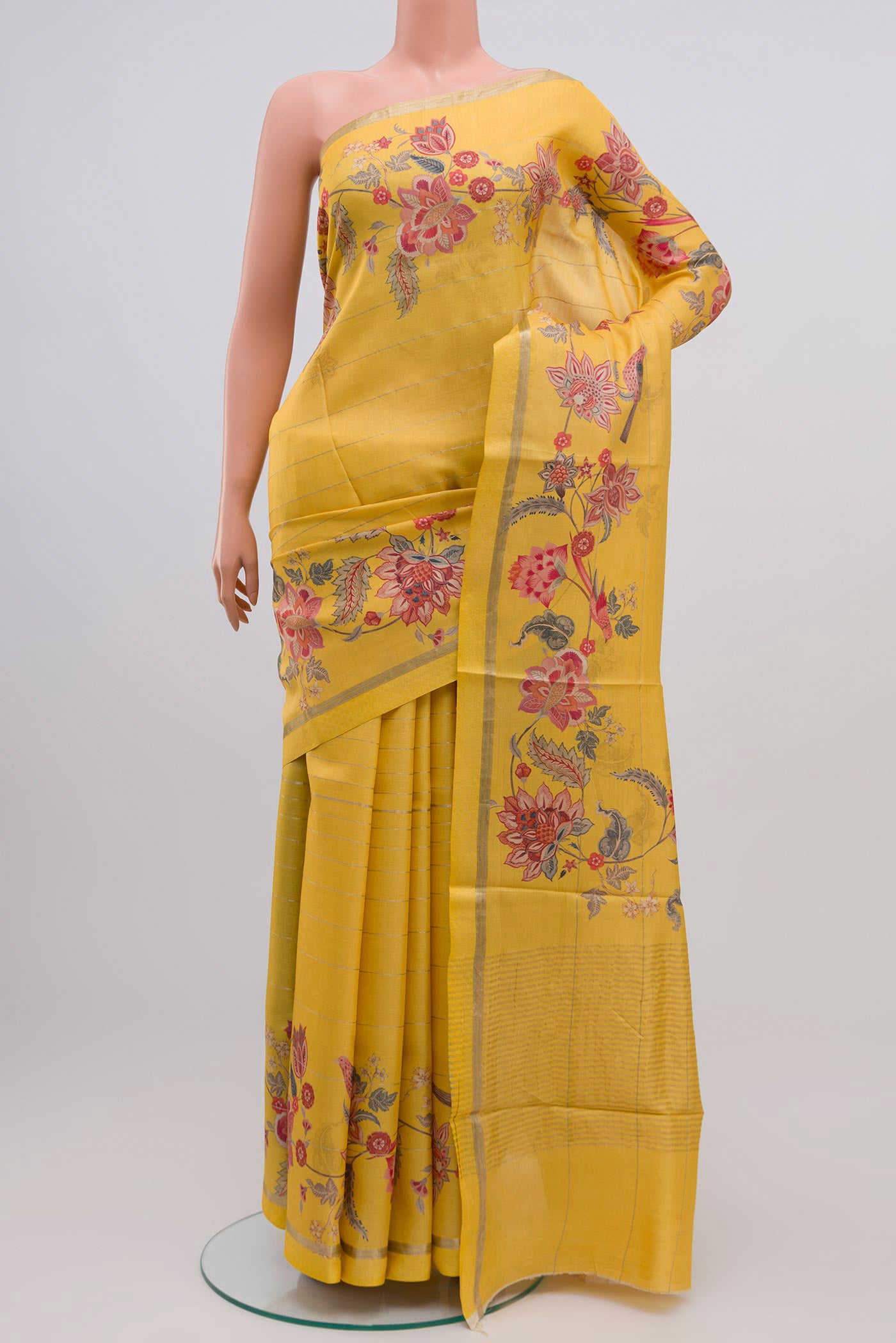 Yellow Tussar Silk Saree with Fancy on the body and Thin Zari Line.  displayed on a mannequin