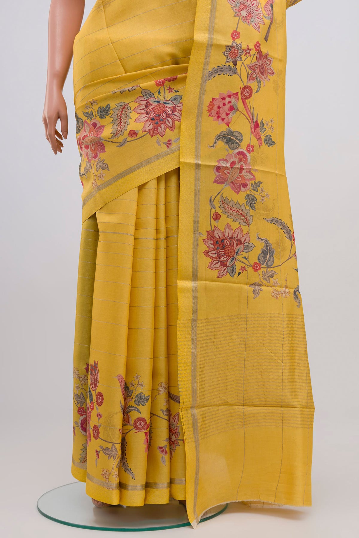 Pleats and pallu of Yellow Tussar Silk Saree with Fancy on the body and Thin Zari Line. 