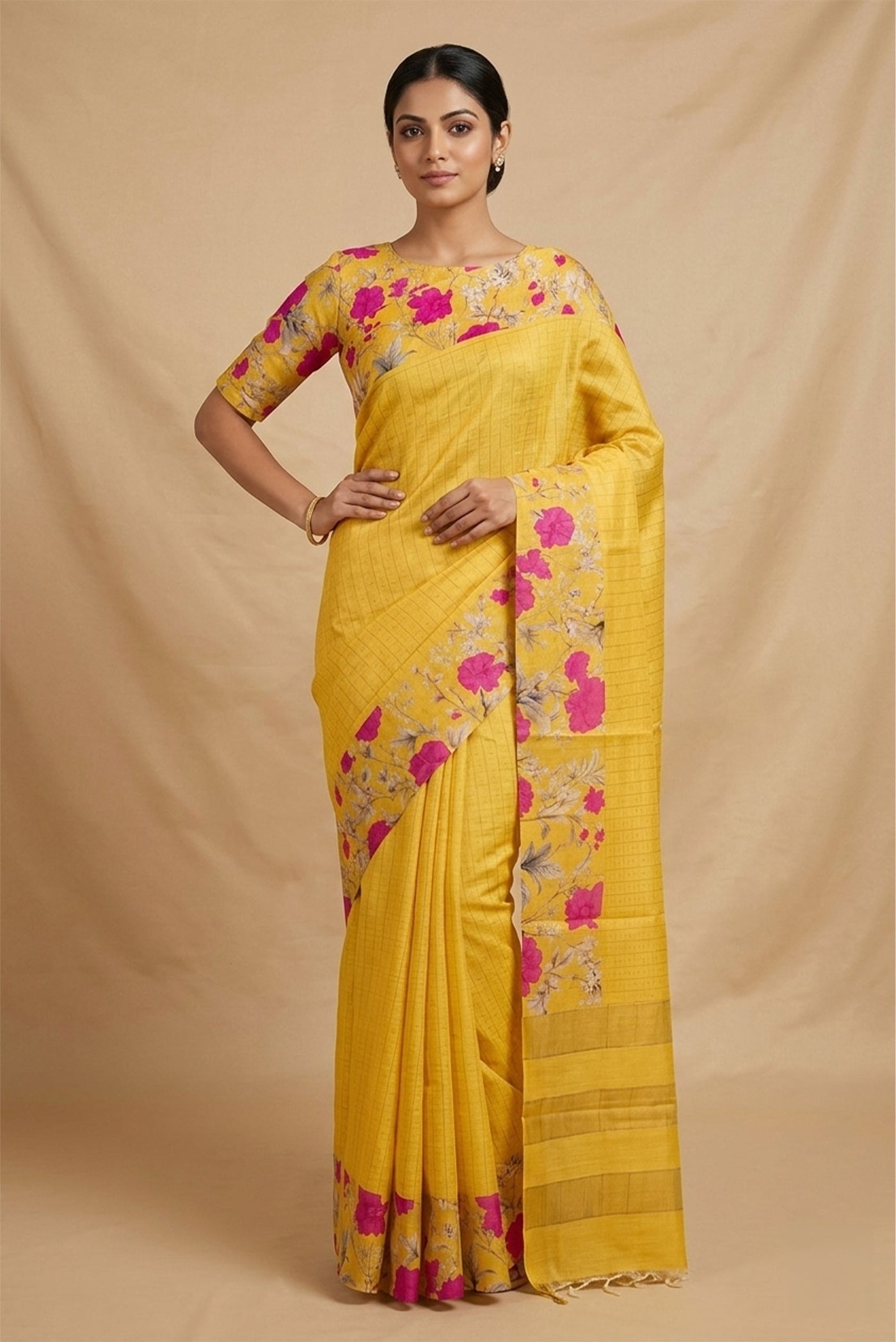 Model wearing a Yellow Tussar Silk Saree with Checked design on the body and Printed Border.