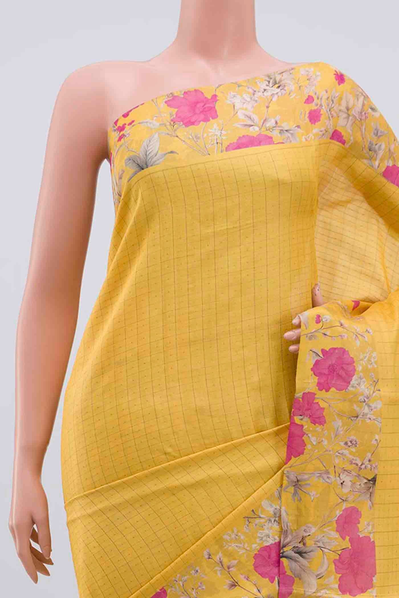Border image of Yellow Tussar Silk Saree with Checked design on the body and Printed Border. 