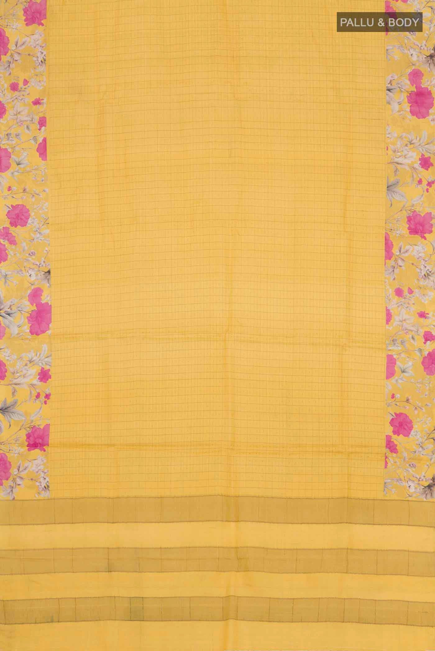 Flat view of Yellow Tussar Silk Saree with Checked design on the body and Printed Border. 