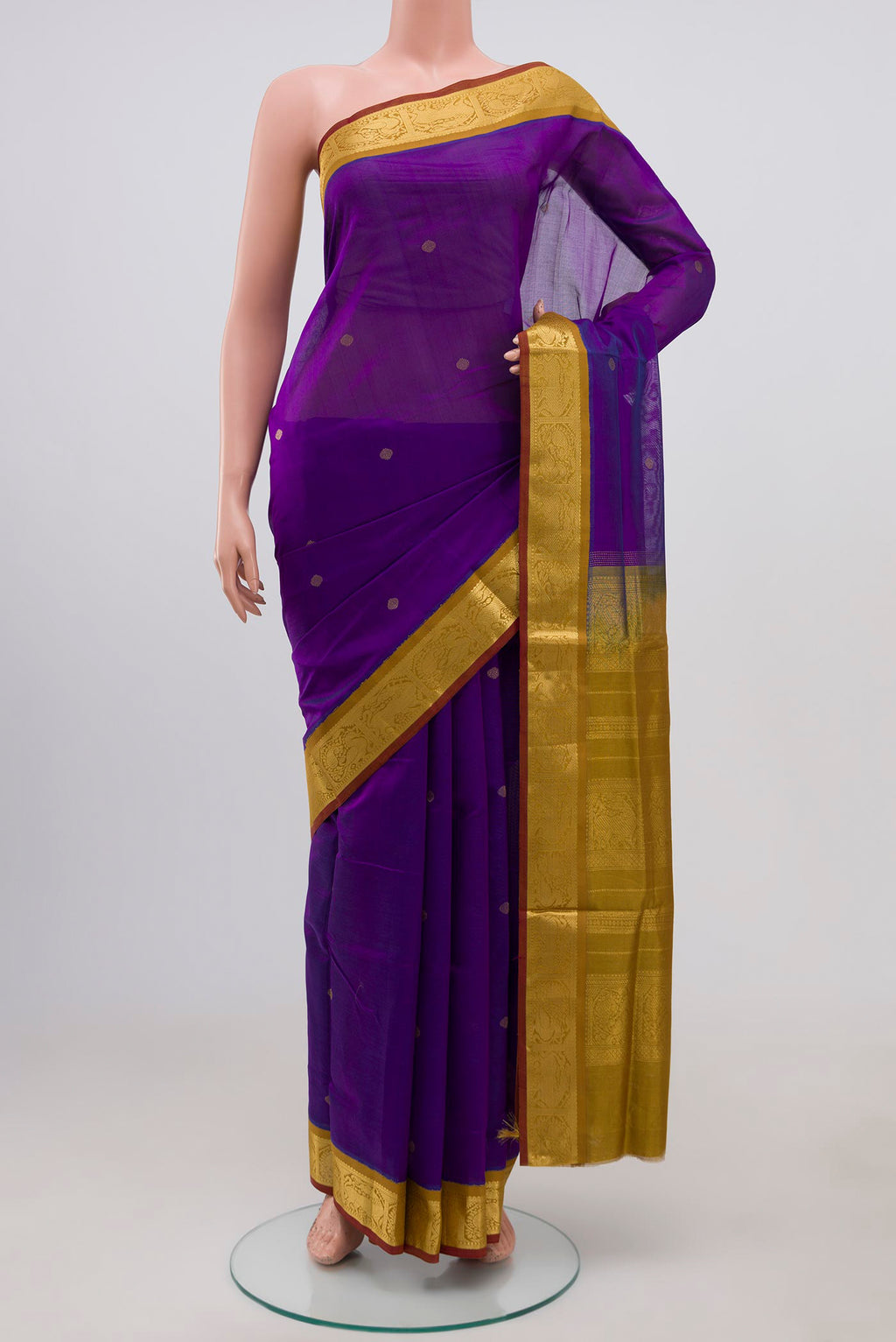 Purple Silk Cotton Saree with Zari Butta on the body and Zari Border.  displayed on a mannequin