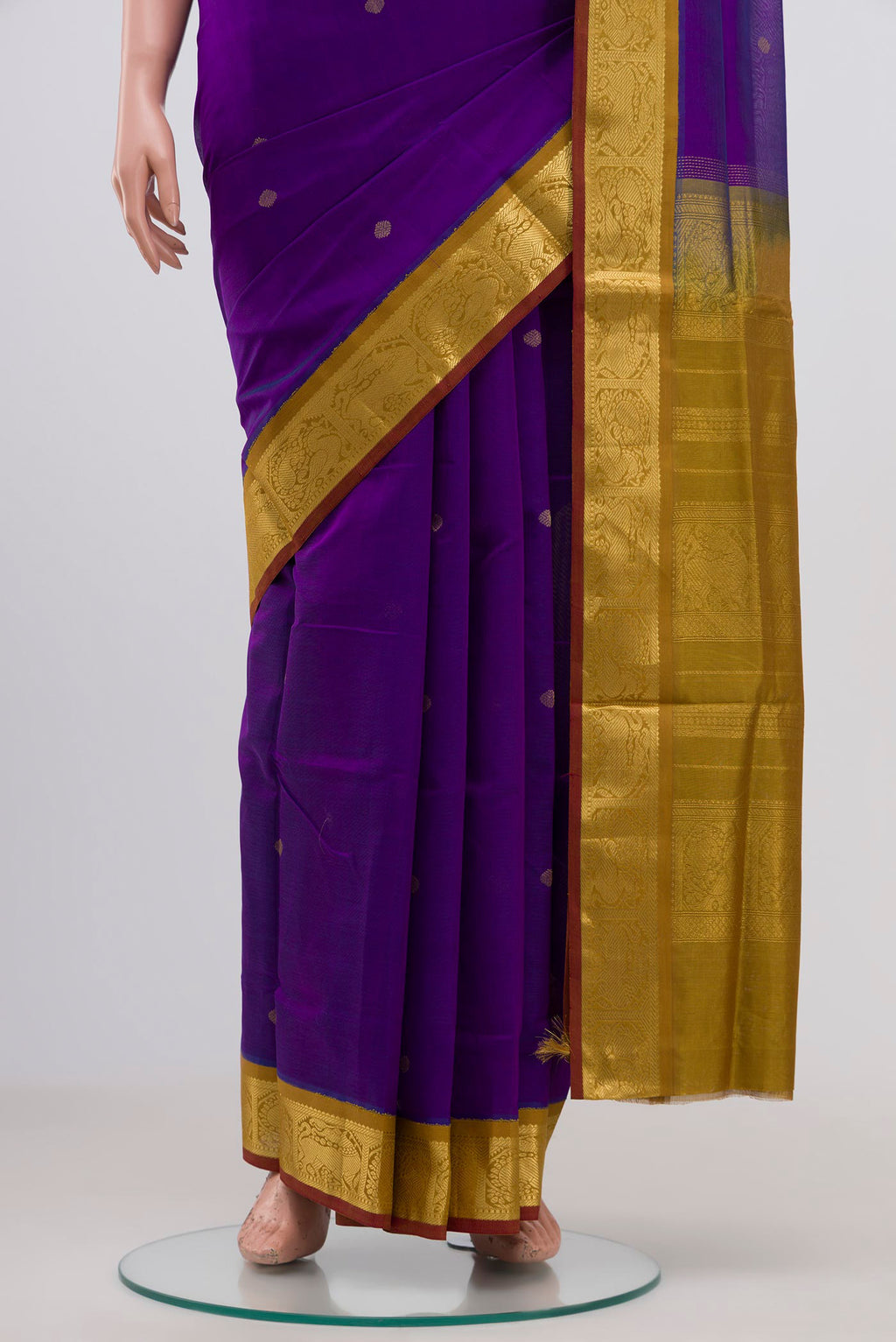 Pleats and pallu of Purple Silk Cotton Saree with Zari Butta on the body and Zari Border. 