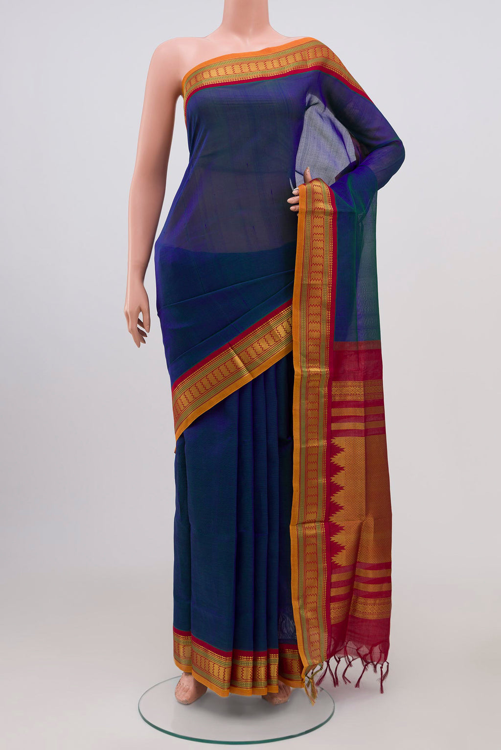 Peacock Blue Silk Cotton Saree with Plain Body and Zari Border.  displayed on a mannequin