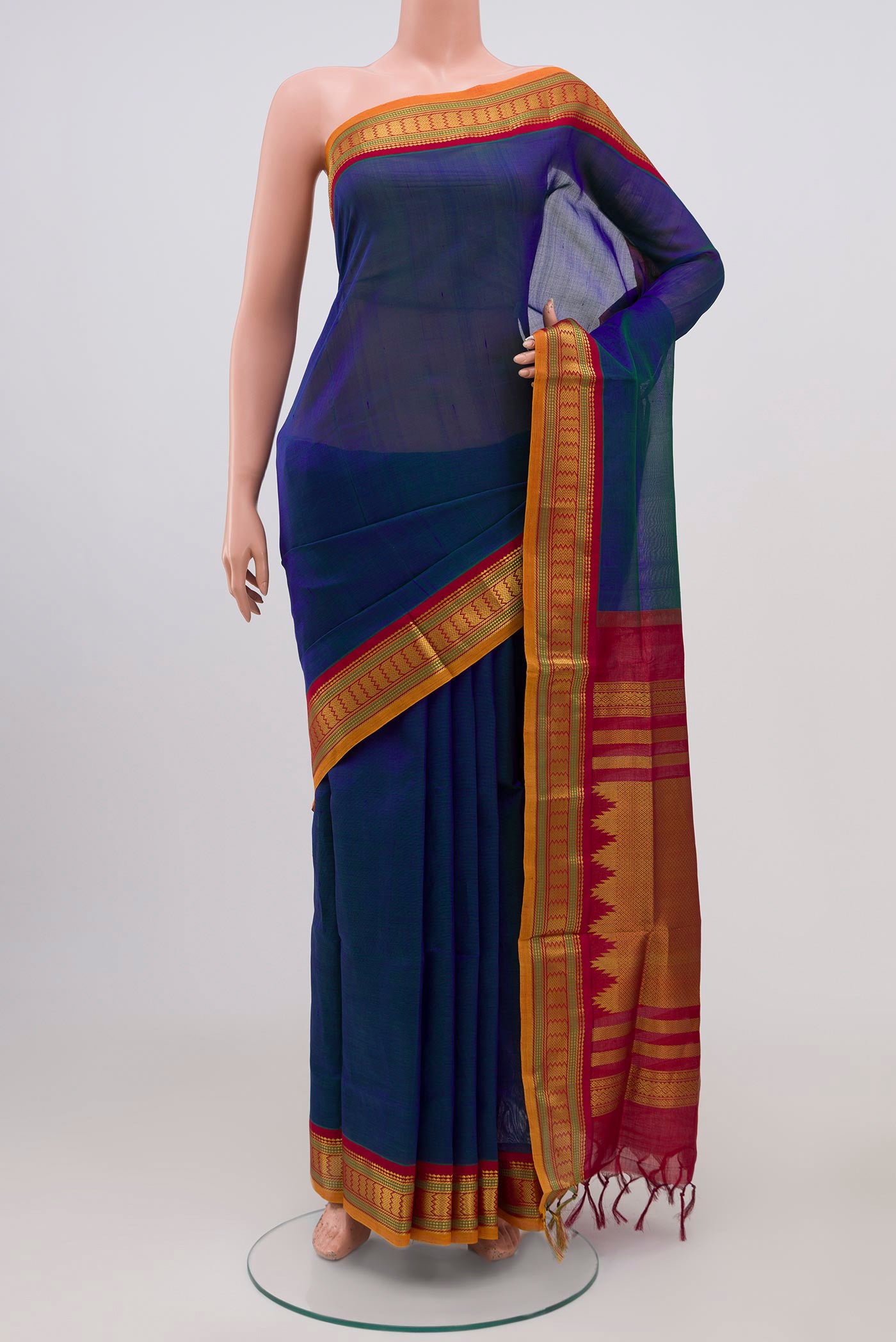 Peacock Blue Silk Cotton Saree with Plain Body and Zari Border.  displayed on a mannequin