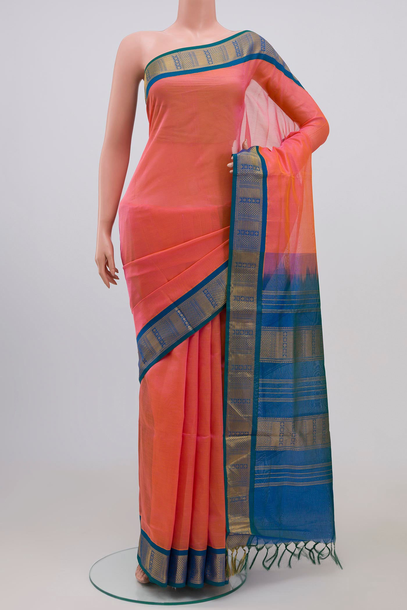 Peach Silk Cotton Saree with Plain Body and Zari Border.  displayed on a mannequin