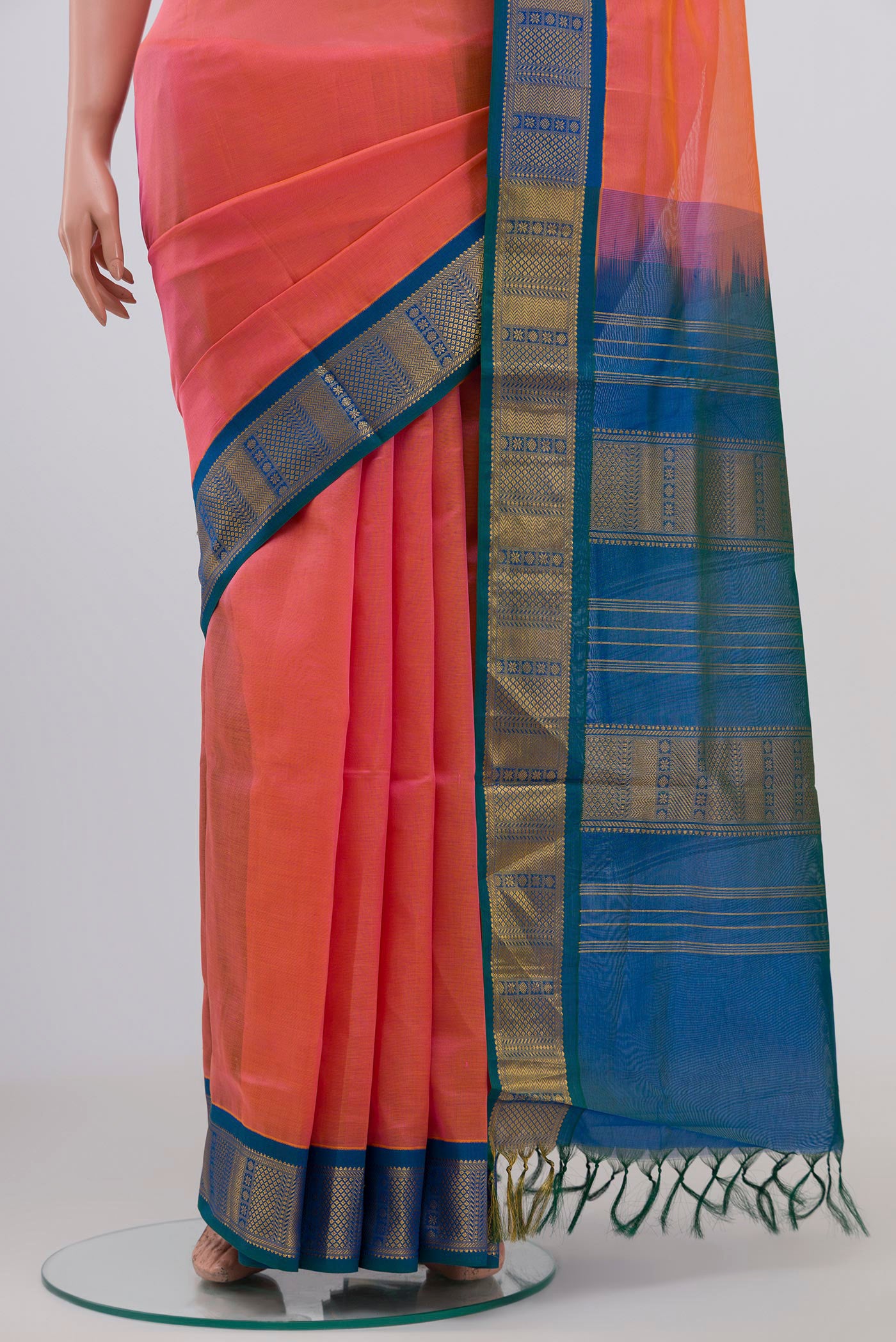 Pleats and pallu of Peach Silk Cotton Saree with Plain Body and Zari Border. 