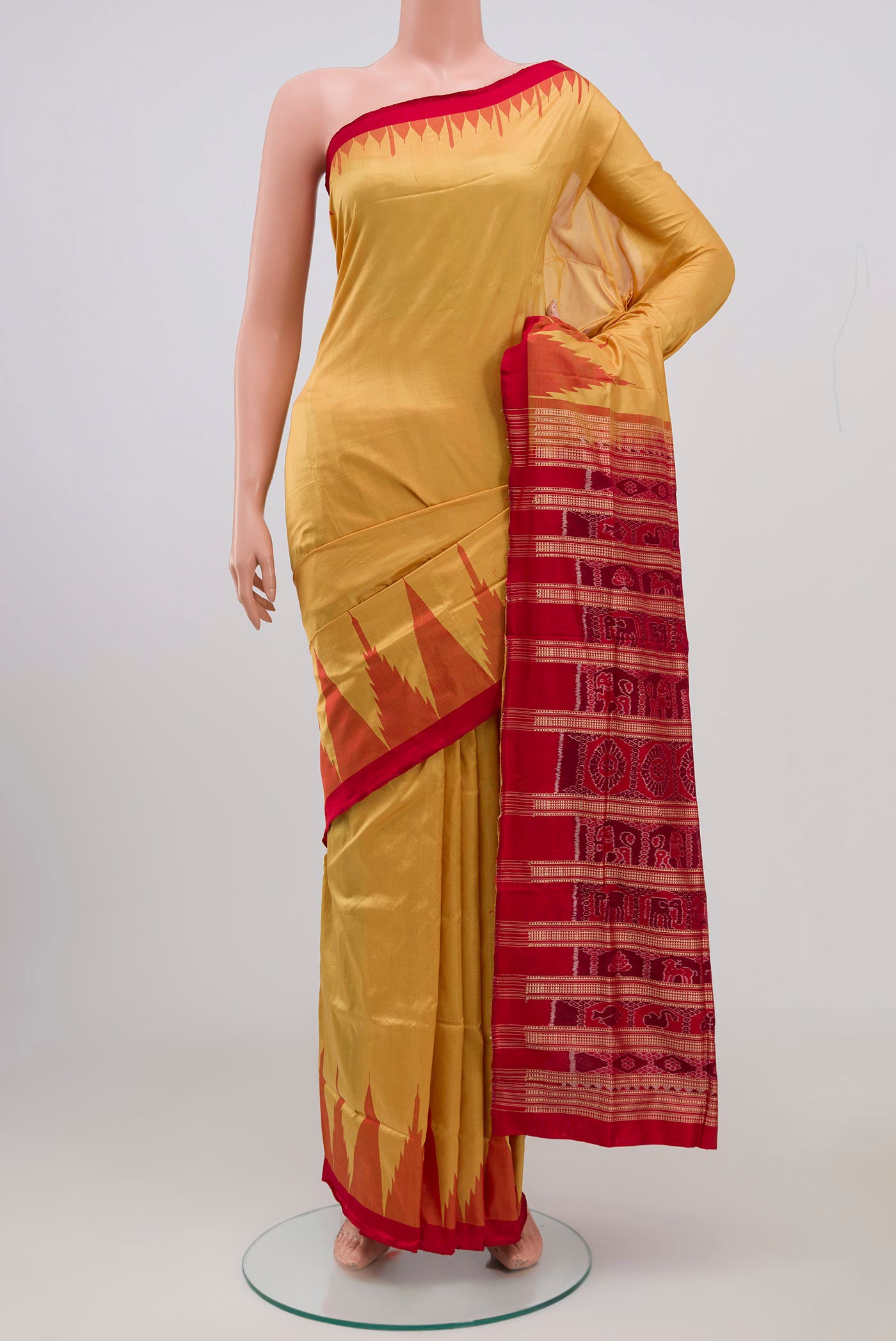 Mustard Orissa Silk Saree with Plain Body and Temple Border.  displayed on a mannequin