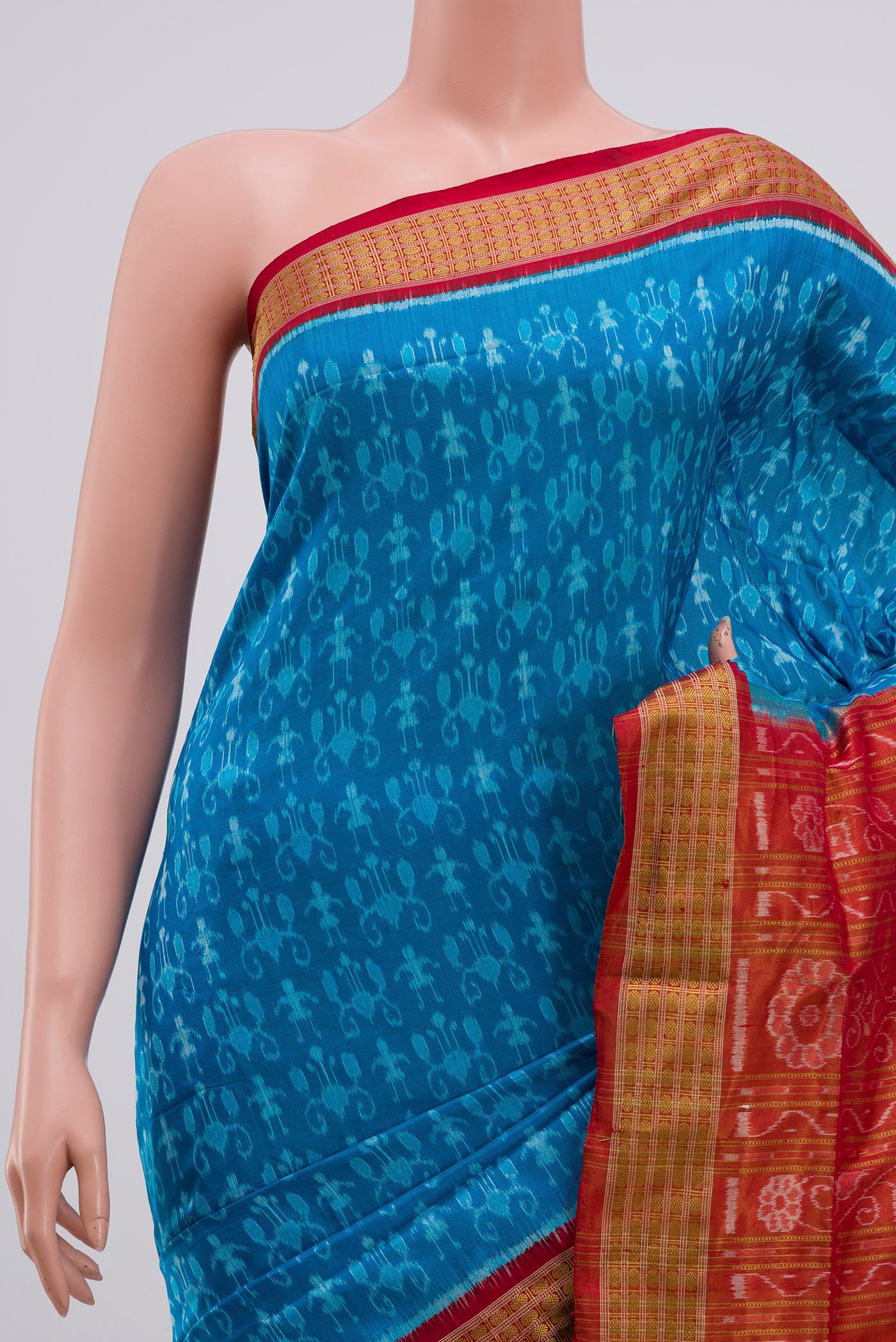 Border image of Blue Orissa Silk Saree with Ikat Print on the body and Zari Border. 