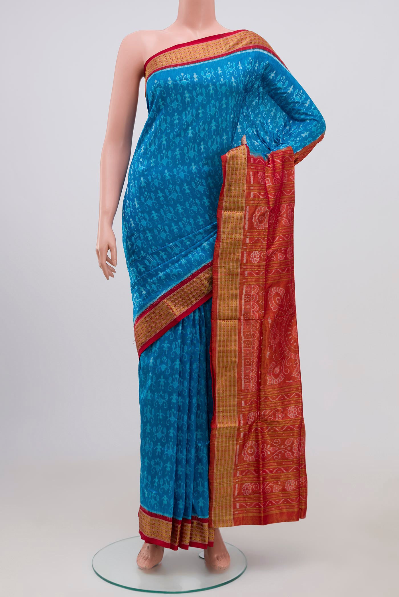 Blue Orissa Silk Saree with Ikat Print on the body and Zari Border.  displayed on a mannequin