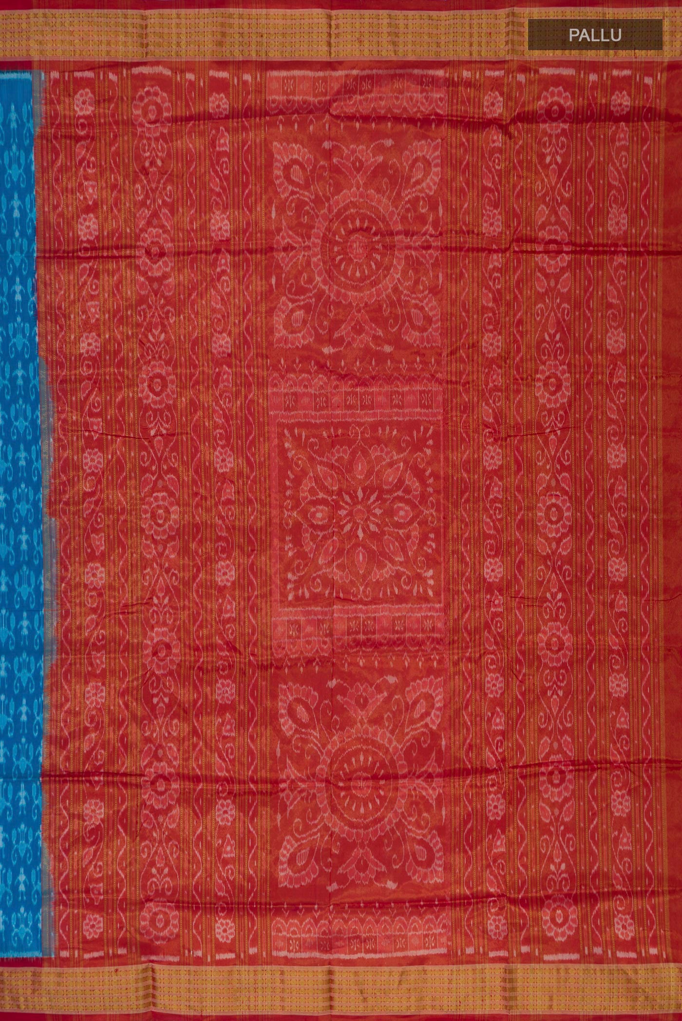 Close up image of the pallu of Blue Orissa Silk Saree with Ikat Print on the body and Zari Border. 