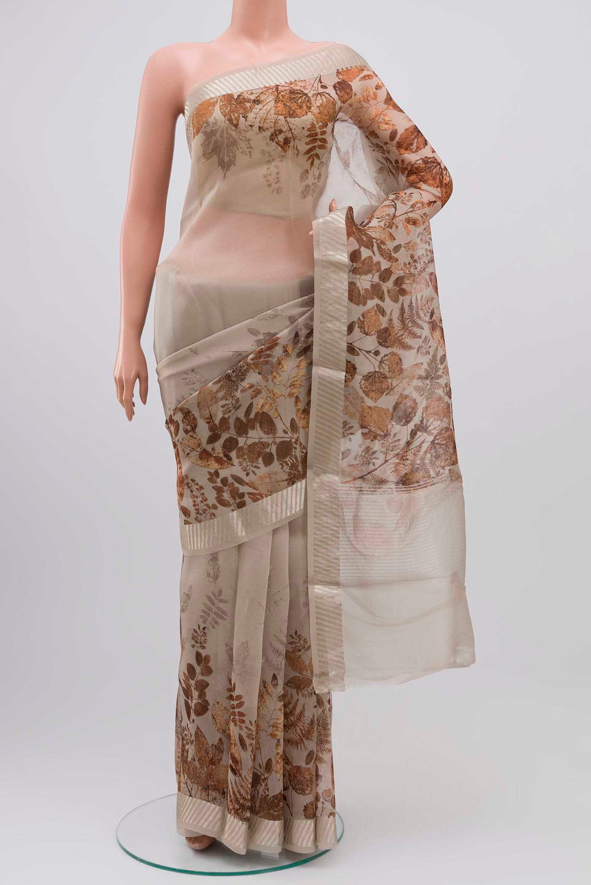 Grey Organza Silk Saree with Floral Print on the body and Zari Border displayed on a mannequin
