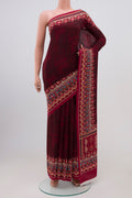 Deep Red Mysore Crepe Saree with Floral Print on the body and Printed Border.  displayed on a mannequin
