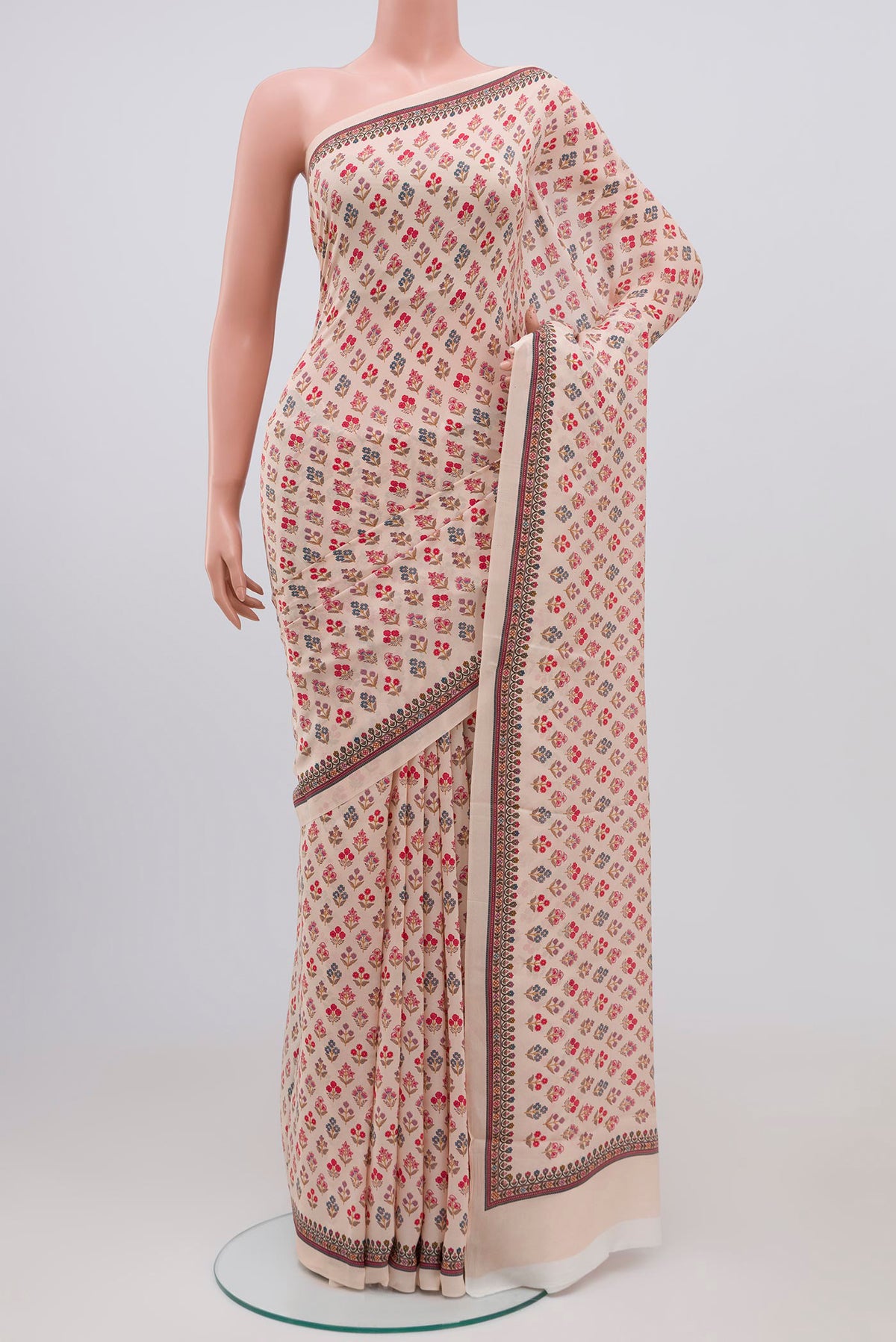 Beige Mysore Crepe Saree with Floral Print on the body and Printed Border.  displayed on a mannequin