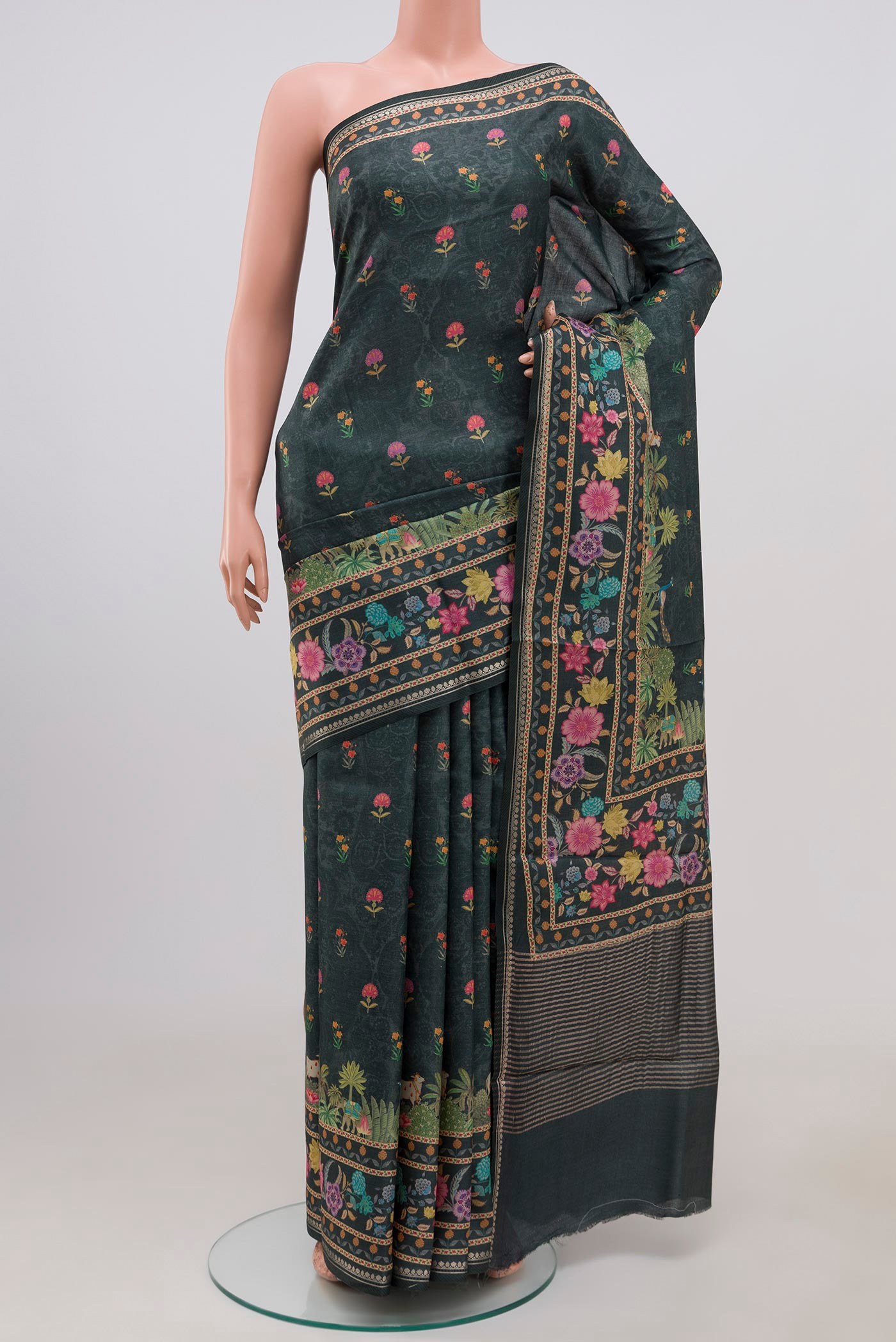 Green Tussar Silk Saree with Fancy on the body and Fancy Border.  displayed on a mannequin