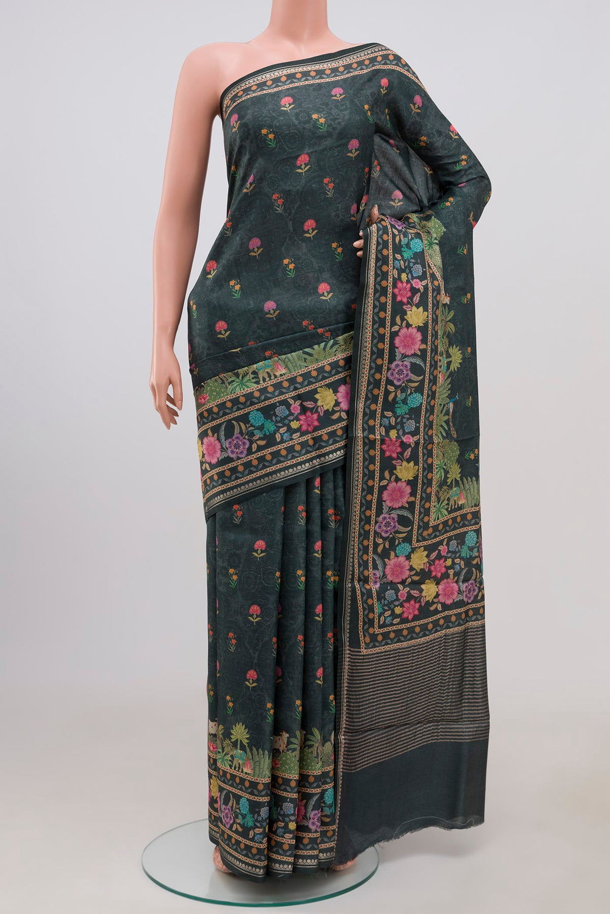 Green Tussar Silk Saree with Fancy on the body and Fancy Border.  displayed on a mannequin