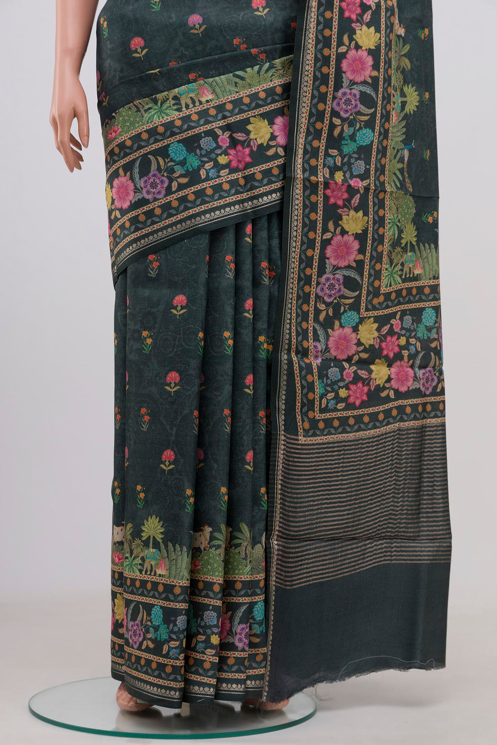 Pleats and pallu of Green Tussar Silk Saree with Fancy on the body and Fancy Border. 